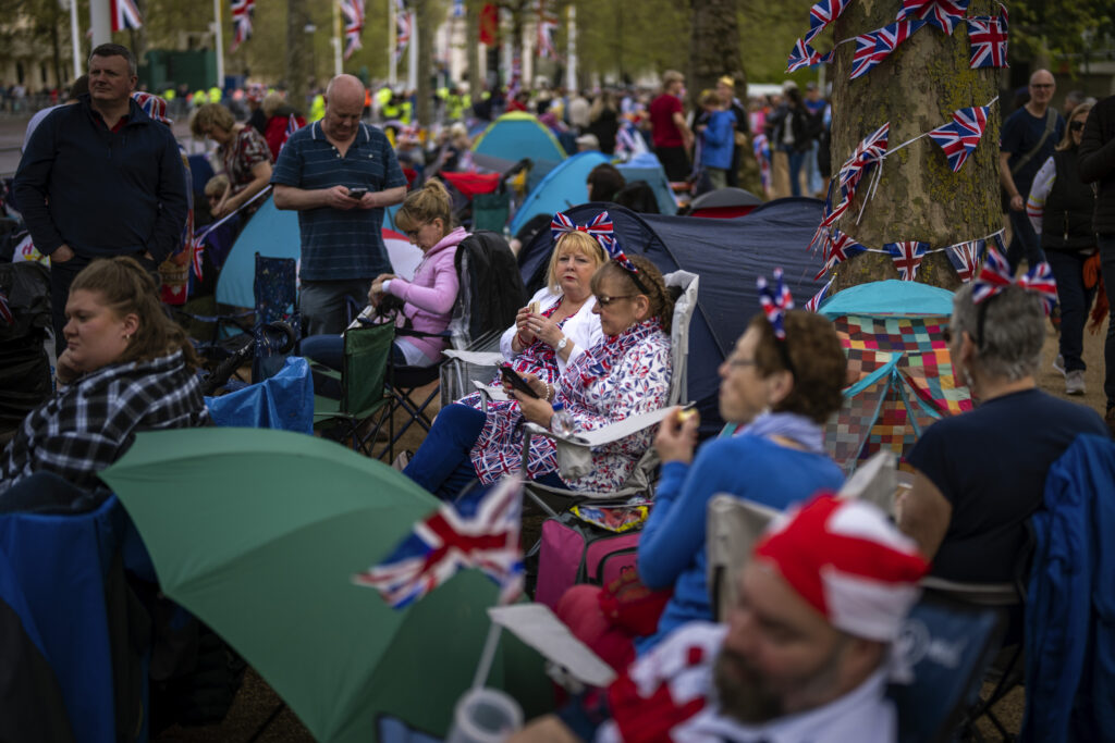 Royal fans gather along the King's Coronation route at The Mall in London, Friday, May 5, 2023. The Coronation of King Charles III will take place at Westminster Abbey on May 6. (AP Photo/Emilio Morenatti)