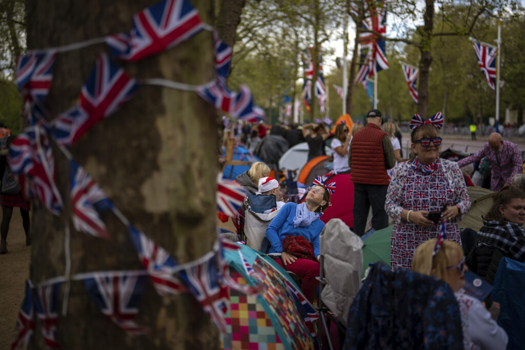 Royal fans gather along the King's Coronation route at The Mall in London, Friday, May 5, 2023. The Coronation of King Charles III will take place at Westminster Abbey on May 6. (AP Photo/Emilio Morenatti)
