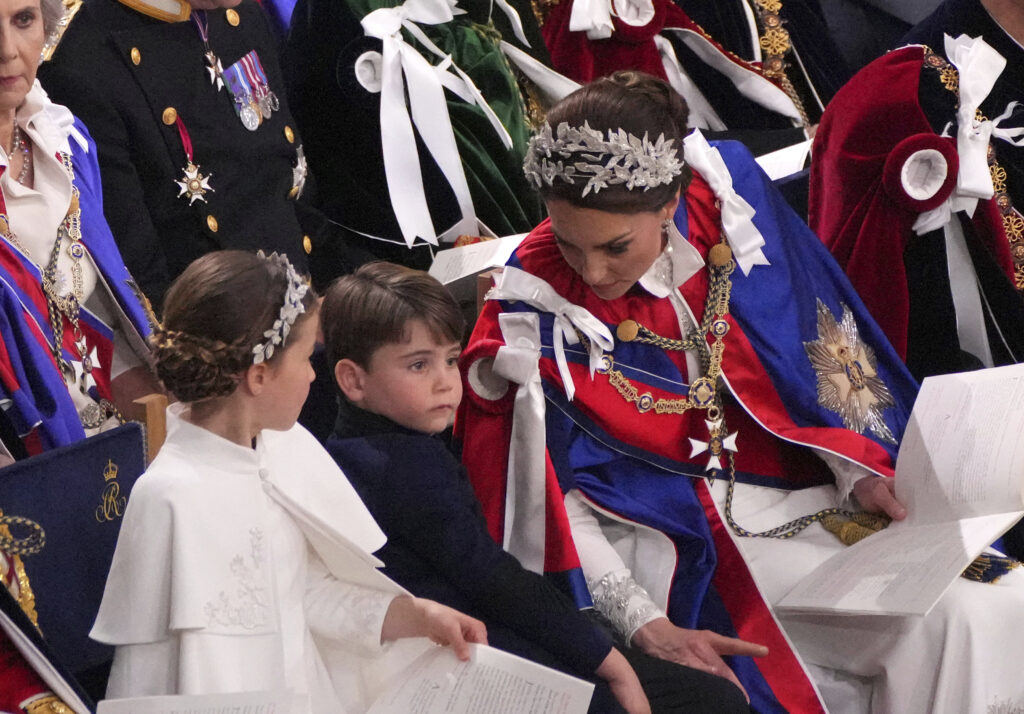 Kate, Princess of Wales, right, Princess Charlotte, left, and Prince Louis, centre, attend the coronation ceremony of King Charles III and Queen Camilla in Westminster Abbey, London, Saturday, May 6, 2023. (Aaron Chown/Pool Photo via AP)