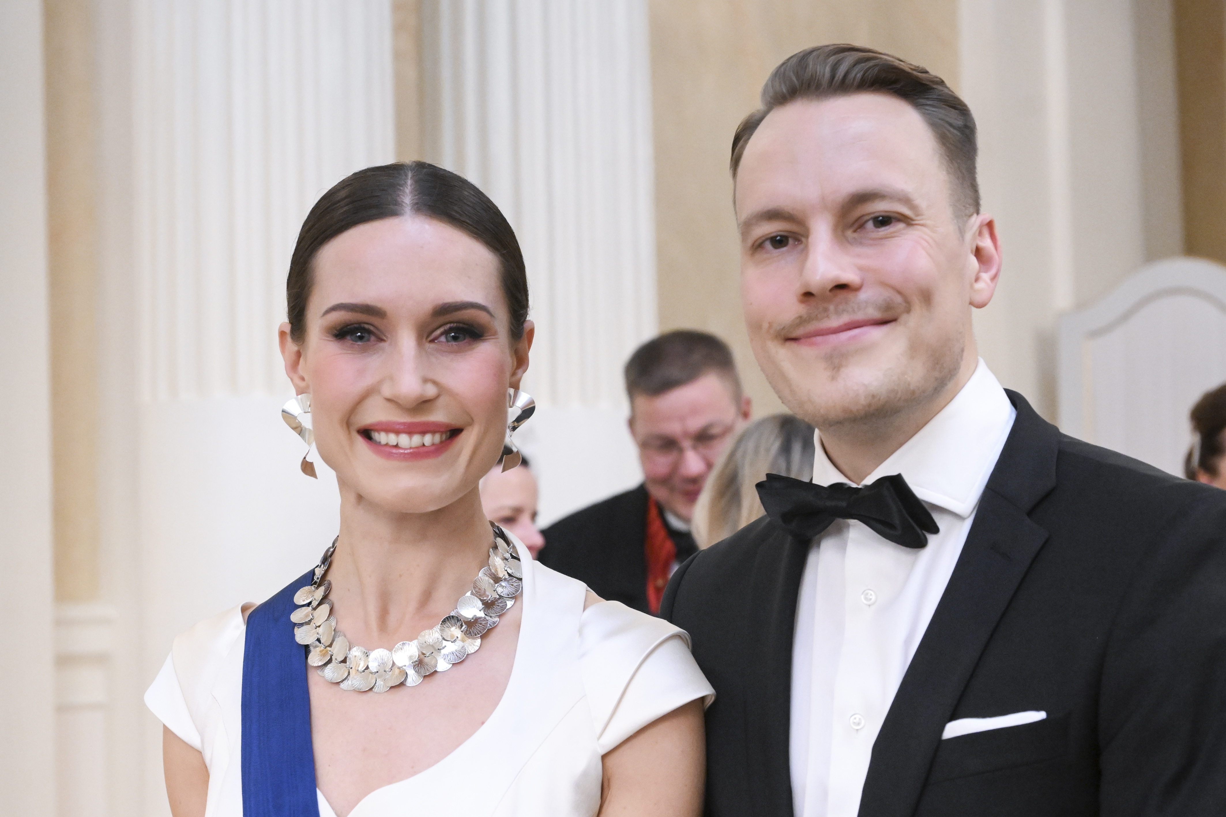 epa10353704 Prime Minister of Finland Sanna Marin (L) and her husband Markus Raikkonen (L) participate  in the Finnish Independence Day celebration at the presidential palace, in Helsinki, Finland, 06 December 2022.  EPA-EFE/KIMMO BRANDT