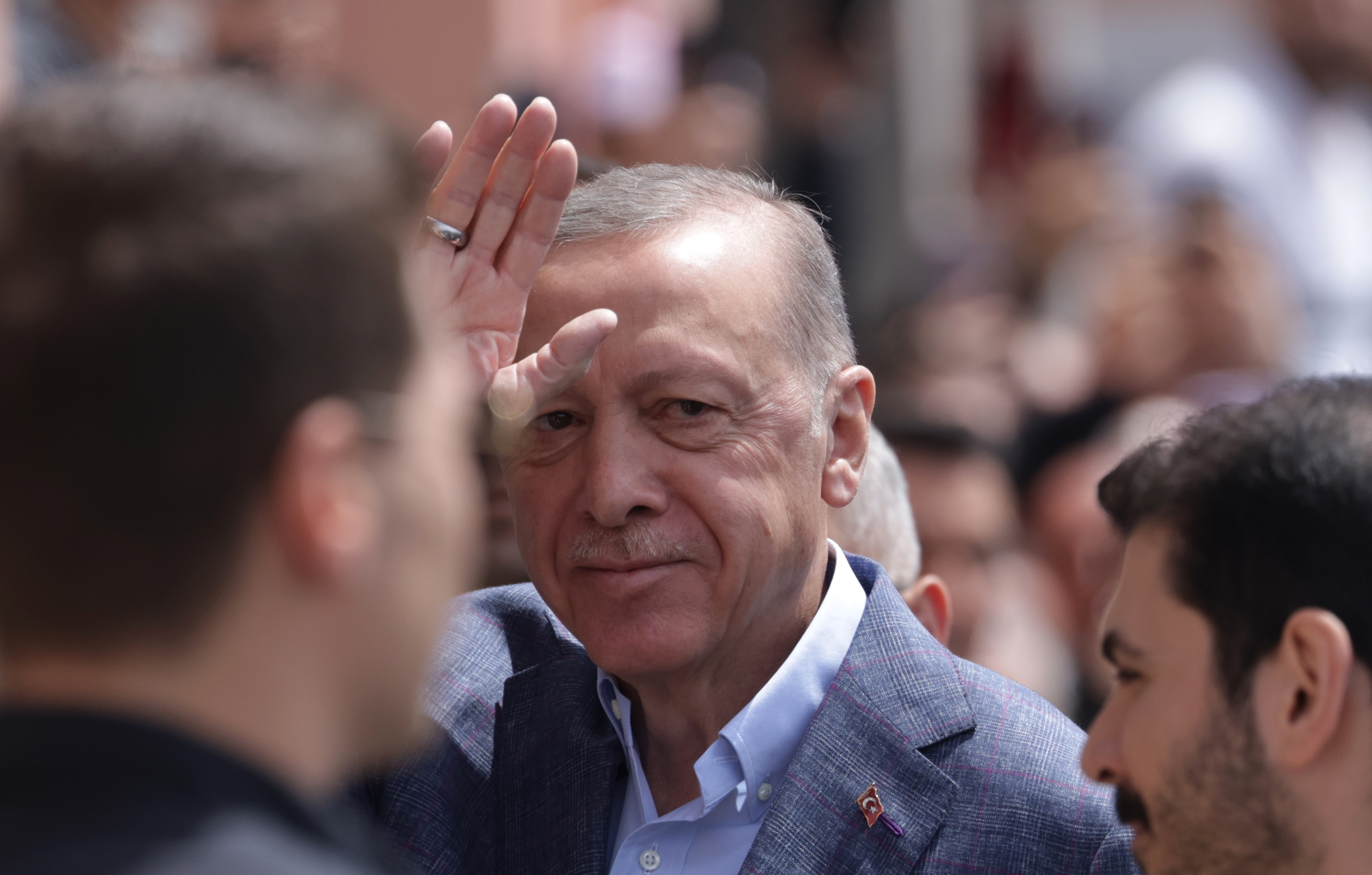 epa10626900 Turkish President Erdogan greets his supporters before he votes for the general elections, at a polling stsation in Istanbul, Turkey, 14 May 2023, as the country holds simultaneous parliamentary and presidential elections.  EPA-EFE/ERDEM SAHIN