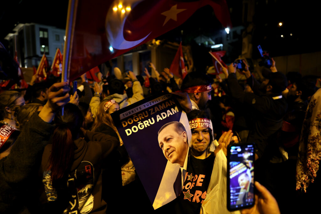 epa10628354 Supporters of Turkish President Recep Tayyip Erdogan gather after early election results were announced in Istanbul, Turkey, 14 May 2023, as the country holds simultaneous parliamentary and presidential elections.  EPA-EFE/TOLGA BOZOGLU