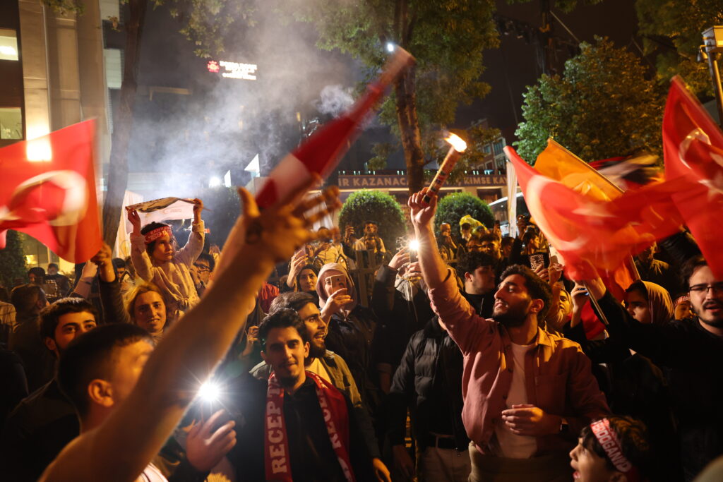 epa10628703 Supporters of Turkish President Recep Tayyip Erdogan react after early election results were announced in Istanbul, Turkey, 14 May 2023, as the country holds simultaneous parliamentary and presidential elections.  EPA-EFE/TOLGA BOZOGLU