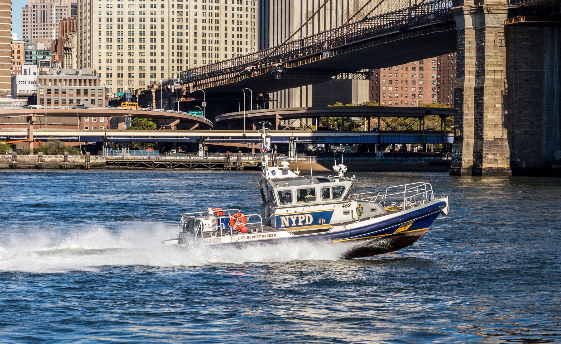 New York Police Department controls with a speed boat the river Hudson