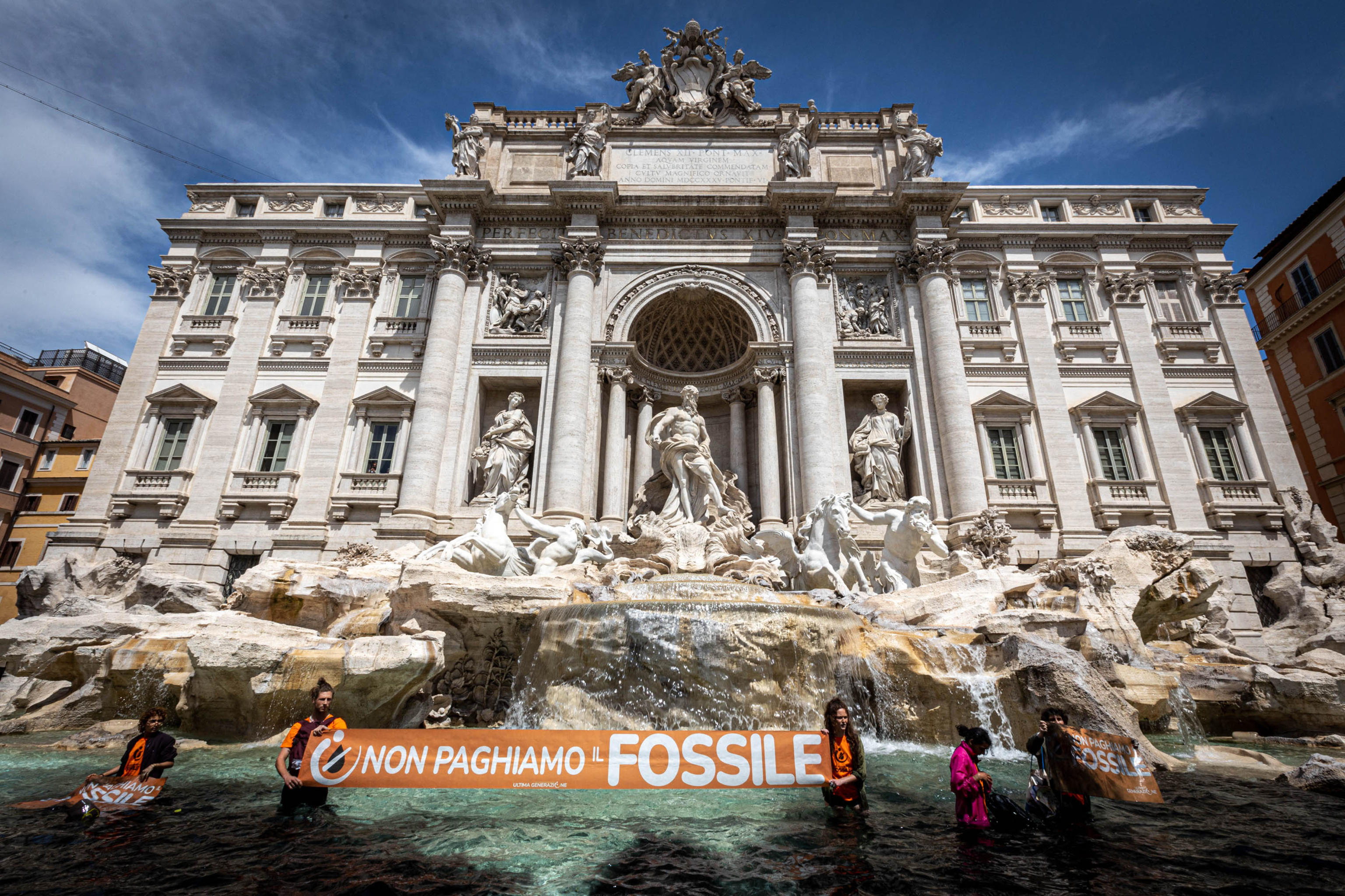 Climate activists pour black liquid into Rome's Trevi Fountain