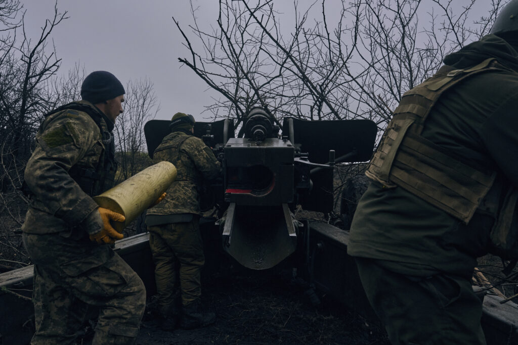 Ukrainian soldiers fire an artillery at Russian positions near Bakhmut, Donetsk region, Ukraine, Sunday, Nov. 20, 2022. (AP Photo/LIBKOS)