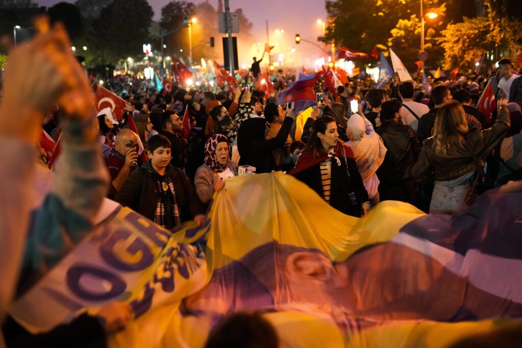 Supporters of President Recep Tayyip Erdogan celebrate in Istanbul, Turkey, Sunday, May 28, 2023. Turkey's President Recep Tayyip Erdogan has won reelection, extending his increasingly authoritarian rule into a third decade. (AP Photo/Francisco Seco)