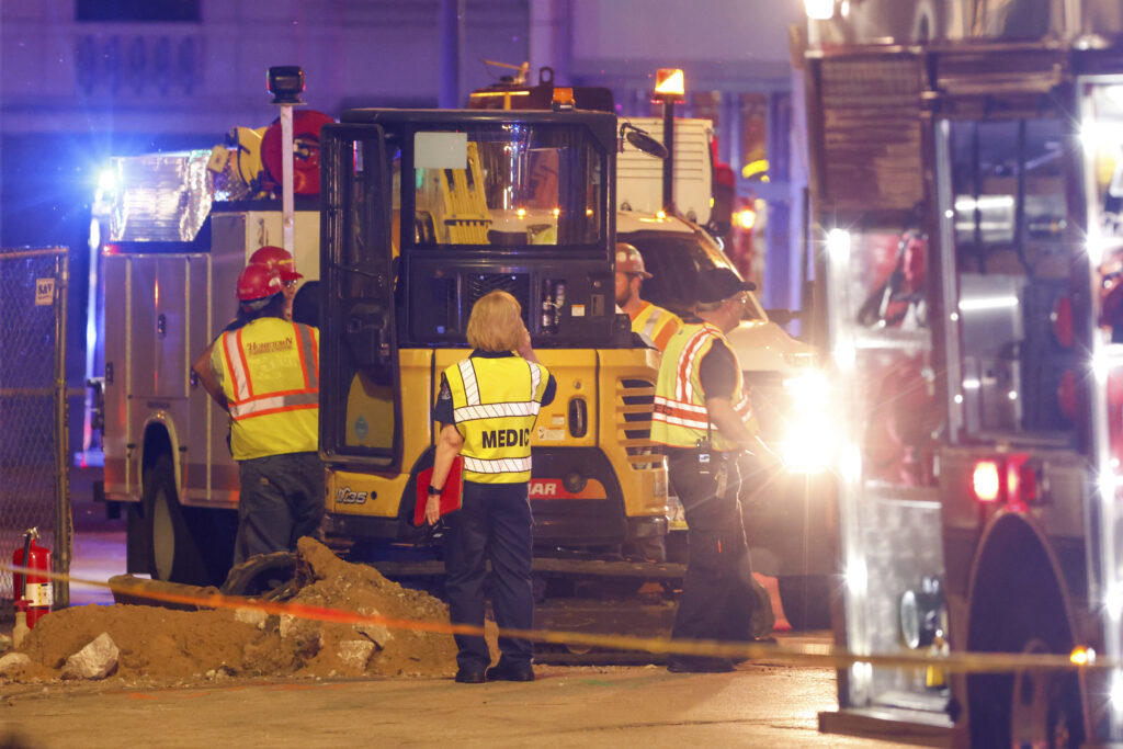 Emergency crews work the scene of a partial building collapse on the 300 block of Main Street, Sunday, May 28, 2023, in Davenport, Iowa. (Nikos Frazier/Quad City Times via AP)