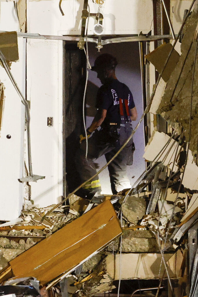 Emergency crews work the scene of a partial building collapse on the 300 block of Main Street, Sunday, May 28, 2023, in Davenport, Iowa. (Nikos Frazier/Quad City Times via AP)