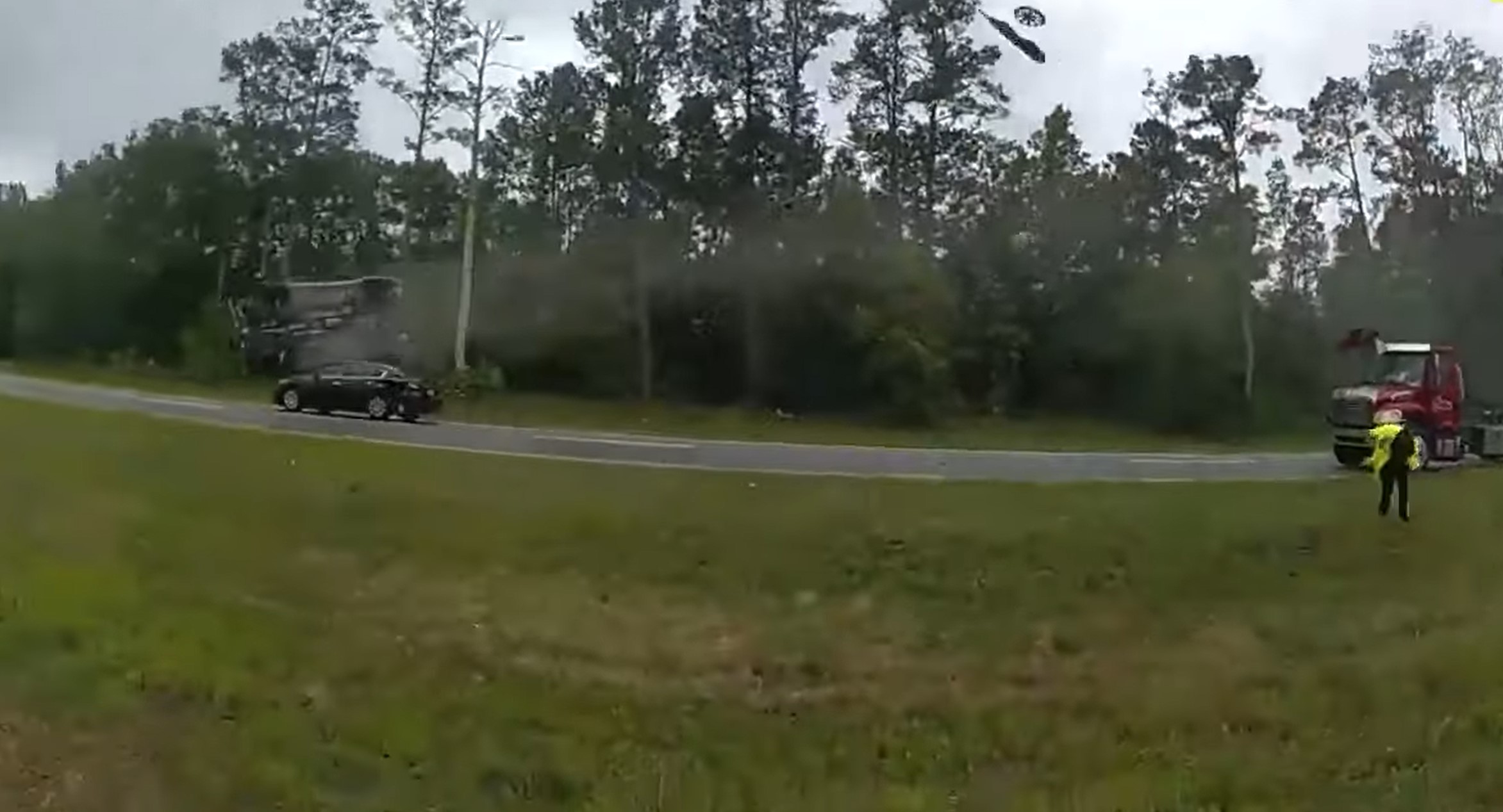 Police bodycam shows driver launch car off tow truck on Georgia Highway