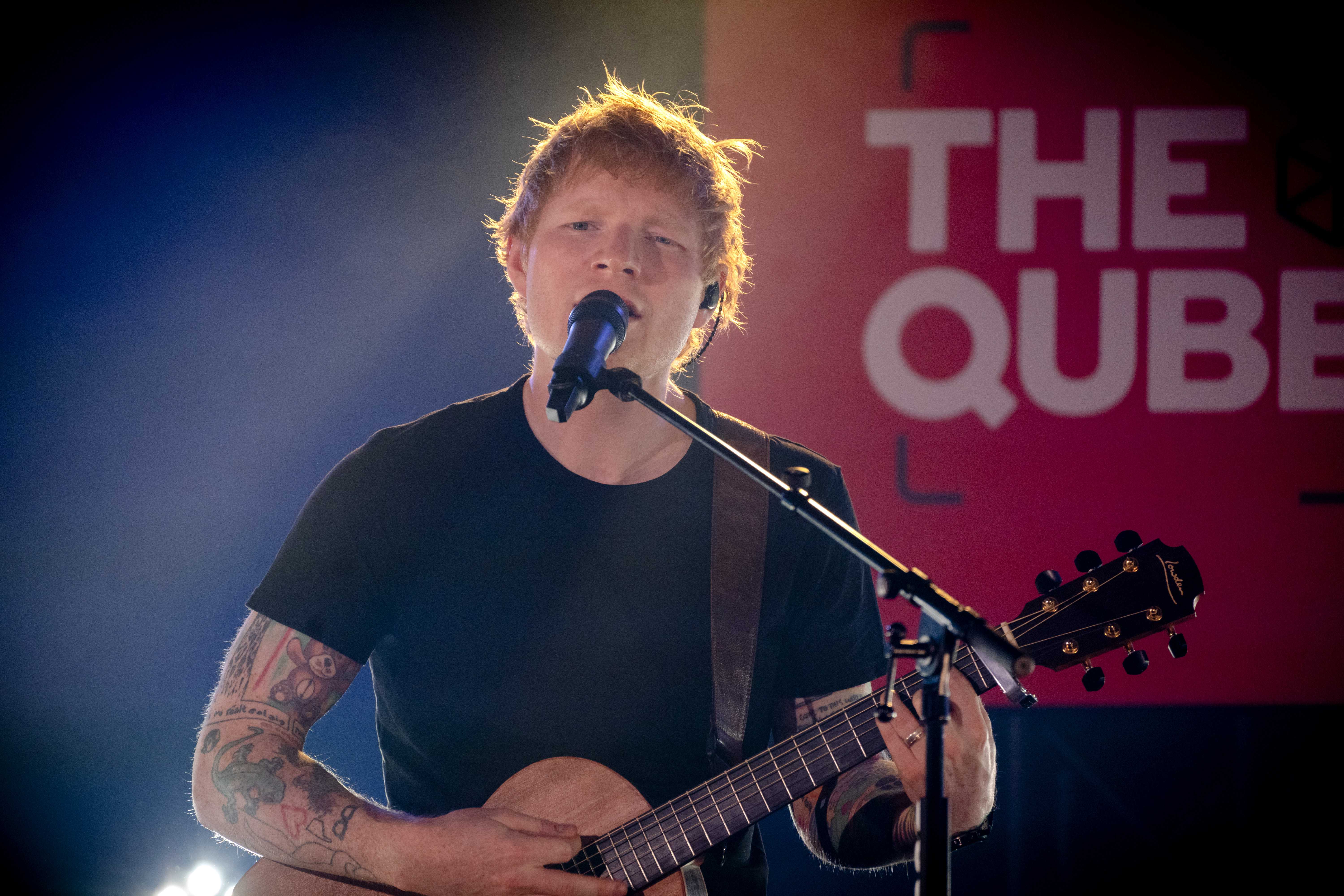epa09508223 British singer Ed Sheeran performs on stage in The Qube by Qmusic in AMsterdam, The Netherlands, 05 October 2021. The British singer played songs from his new album for the first time in the Netherlands.  EPA-EFE/SANDER KONING