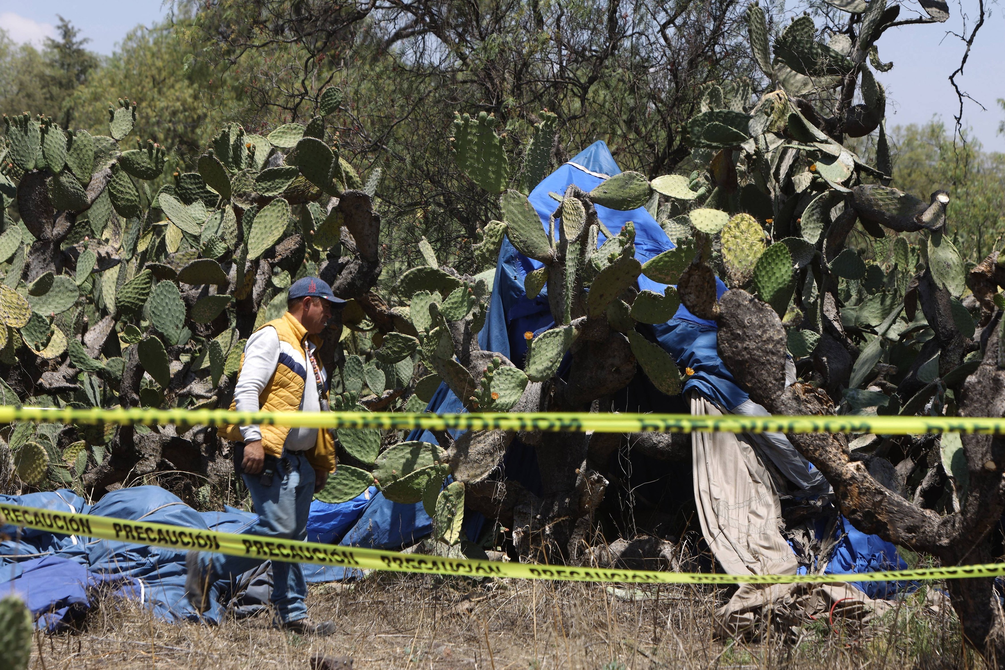 Emergency services at the scene of hot air balloon crash that killed a couple and left their daughter injured.