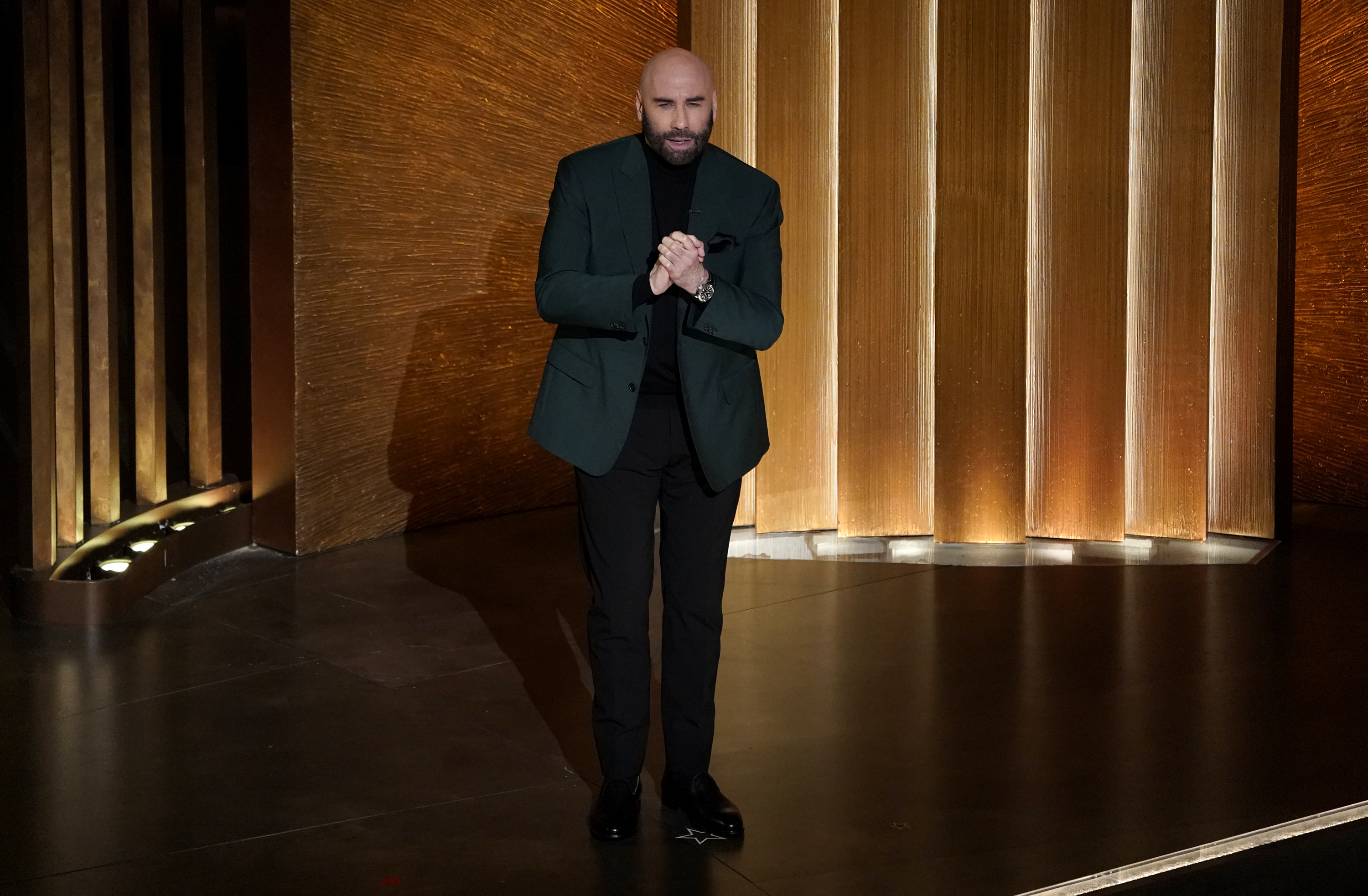 John Travolta speaks at the Oscars on Sunday, March 12, 2023, at the Dolby Theatre in Los Angeles. (AP Photo/Chris Pizzello)