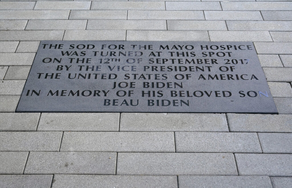 A plaque dedicated to President Joe Biden's late son Beau Biden is seen as he visits Mayo Roscommon Hospice in County Mayo, Ireland, Friday, April 14, 2023. (AP Photo/Patrick Semansky)