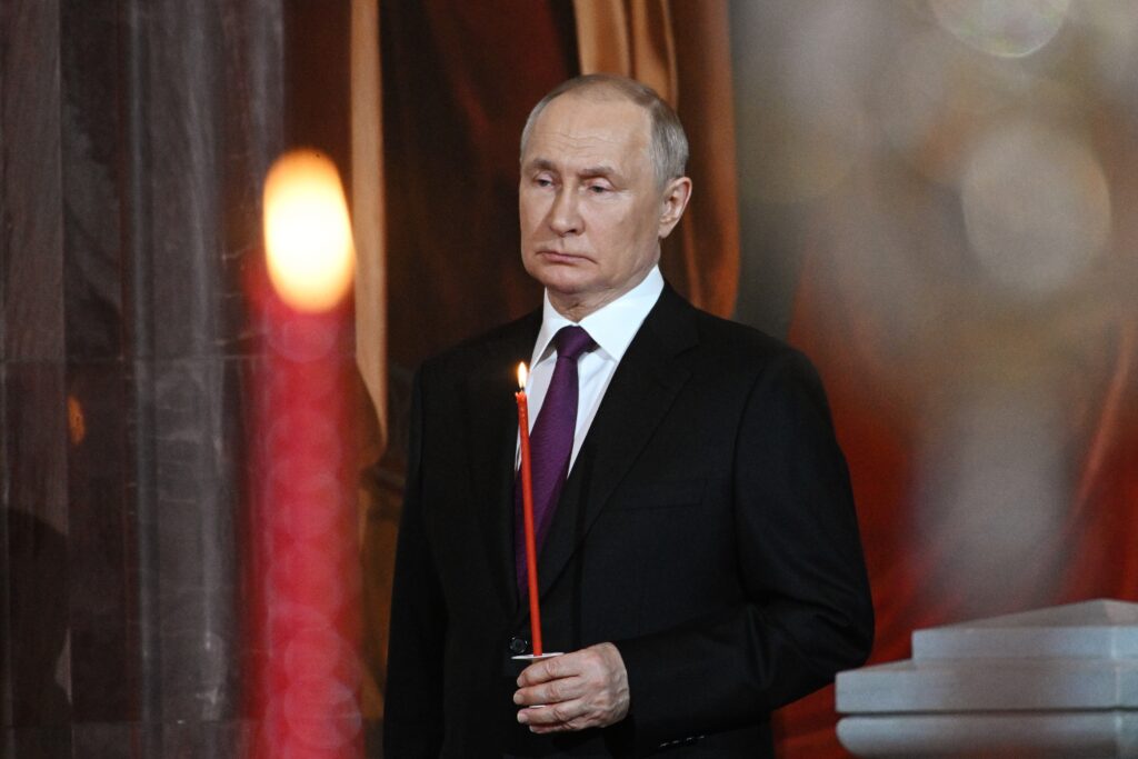 Russian President Vladimir Putin attends an Orthodox Easter service in the Christ the Savior Cathedral in Moscow, Russia, Saturday, April 15, 2023. (Pavel Bednyakov, Sputnik, Kremlin Pool Photo via AP)