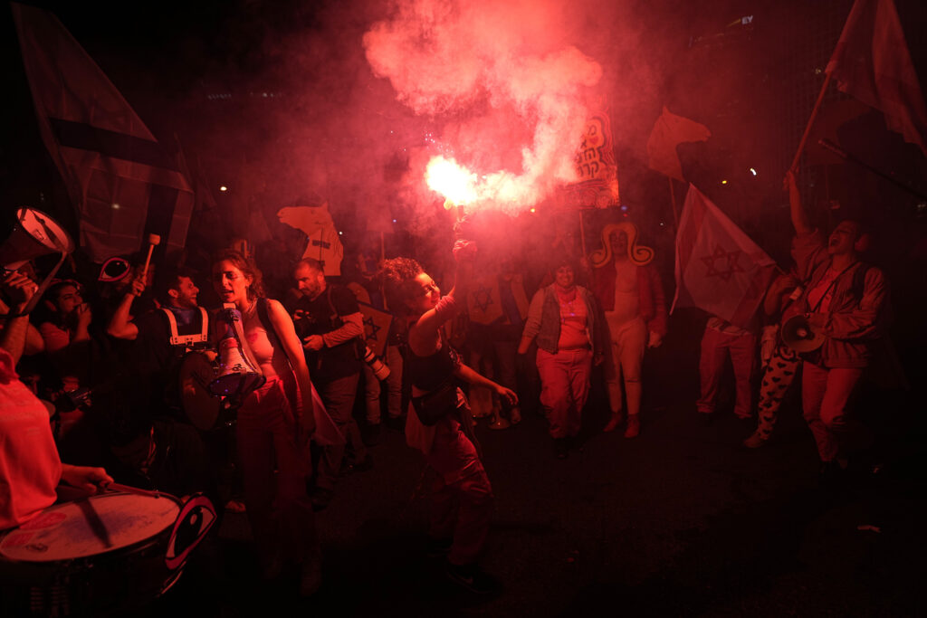 Israelis protest against plans by Prime Minister Benjamin Netanyahu's far-right government to overhaul the judicial system, in Tel Aviv, Israel, Saturday, April 29, 2023. (AP Photo/Ohad Zwigenberg)
