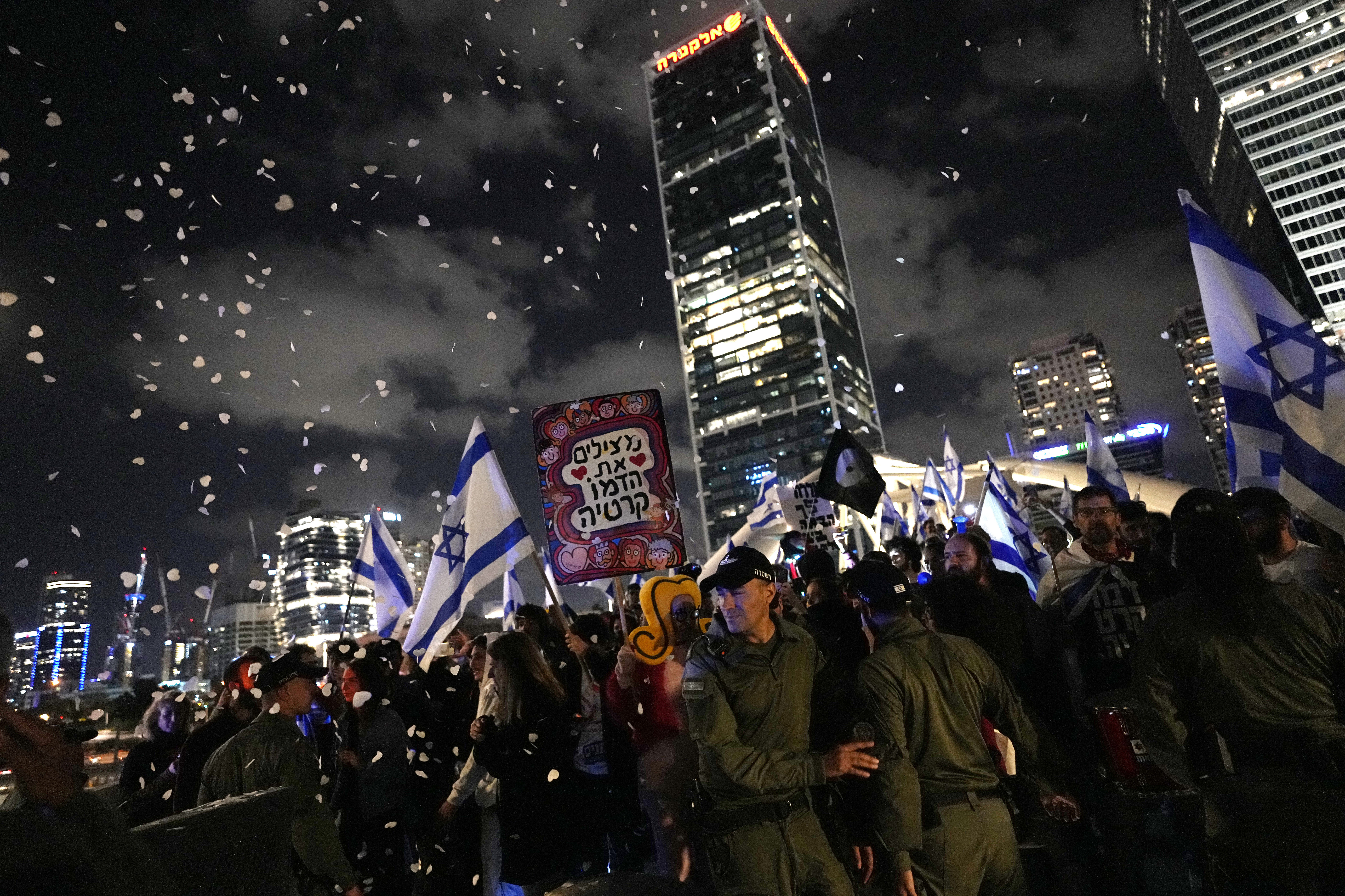 Israelis protest against plans by Prime Minister Benjamin Netanyahu's far-right government to overhaul the judicial system, in Tel Aviv, Israel, Saturday, April 29, 2023. (AP Photo/Ohad Zwigenberg)