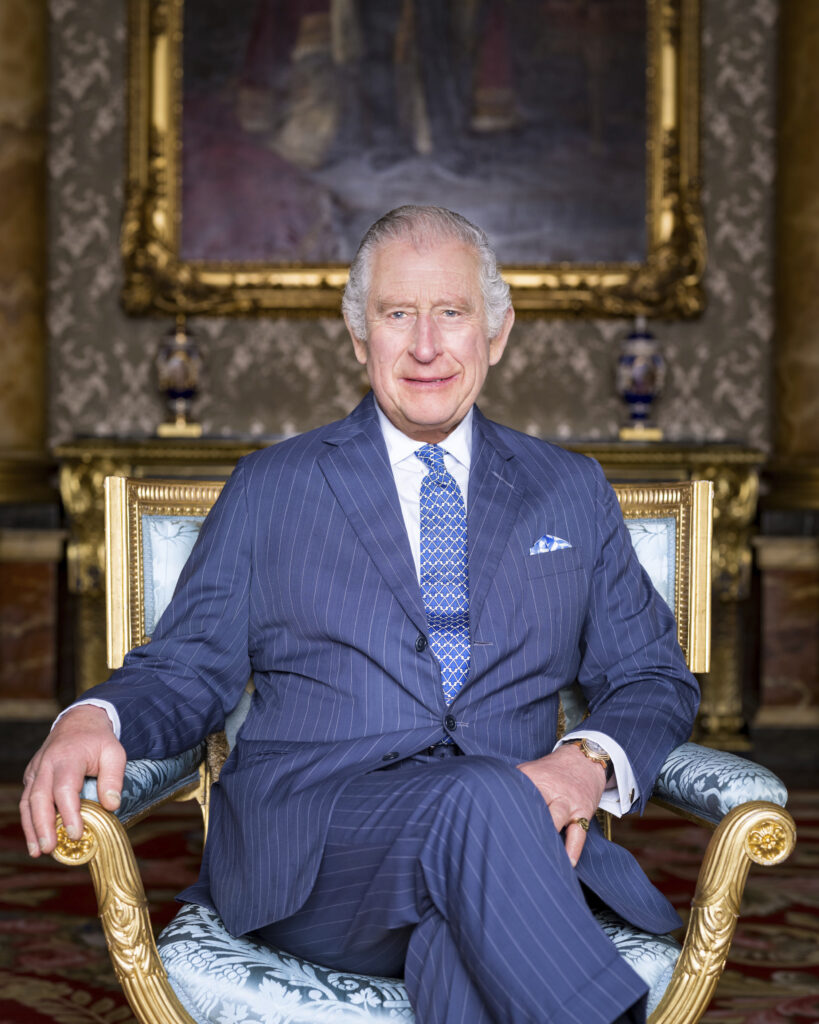 In this photo released by Buckingham Palace, Britain's King Charles III poses for a photograph, in the Blue Drawing Room at Buckingham Palace, London. (Hugo Burnand/Buckingham Palace via AP)