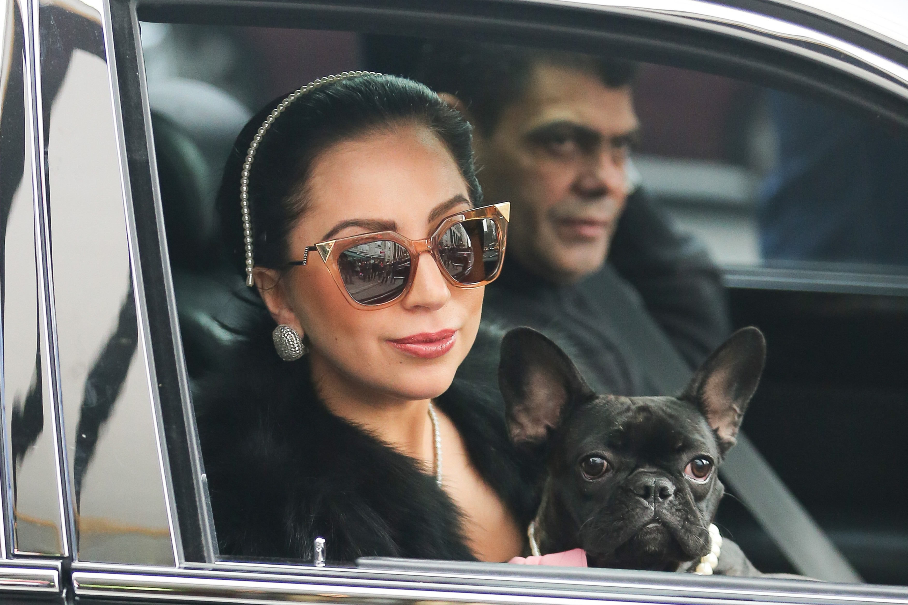 Lady Gaga seen matching pearls with her dog Asia as she exits her apartment in NYC