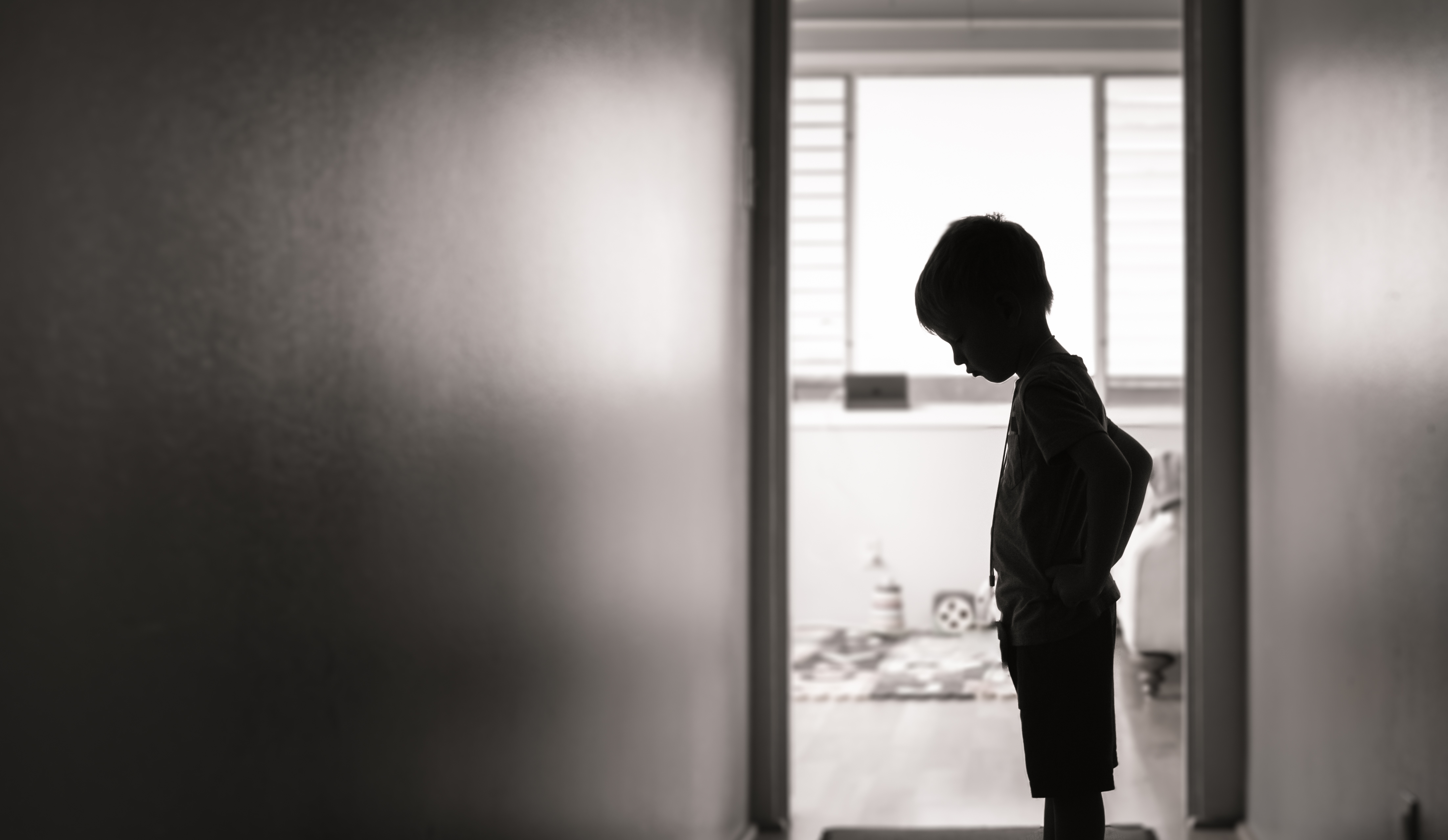 Unhappy,Little,Boy,Silhouette,Indoors