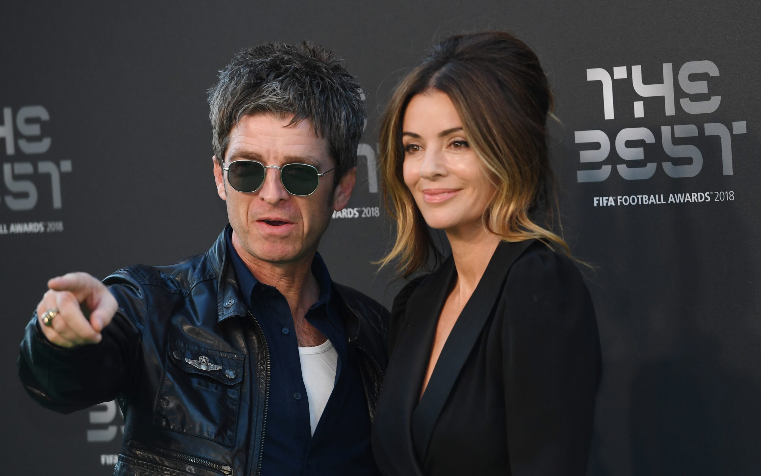 epa07044320 British singer Noel Gallagher and his wife Sara MacDonald (R) arrive for the Best FIFA Football Awards 2018 in London, Britain, 24 September 2018.  EPA-EFE/FACUNDO ARRIZABALAGA