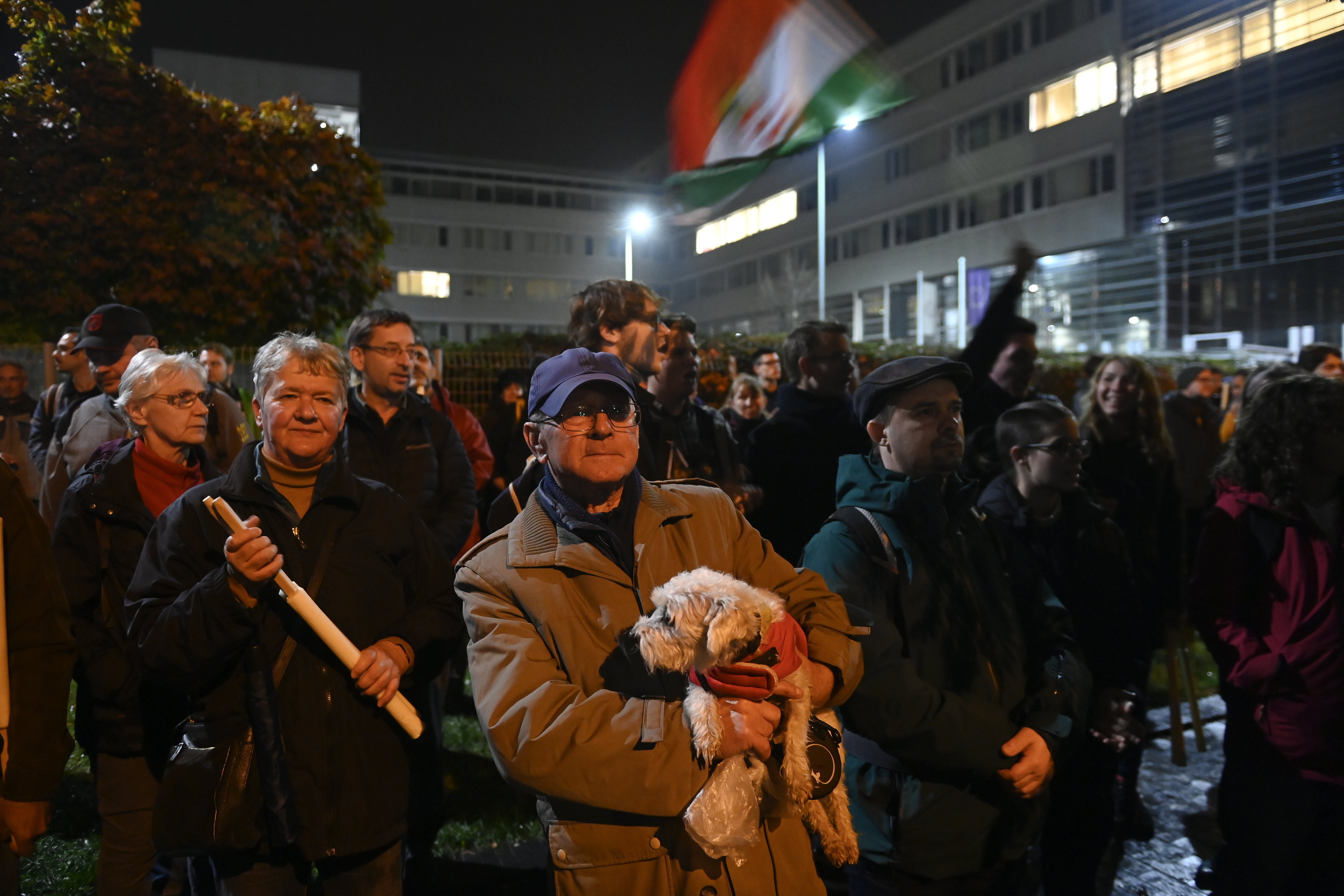 Participants attend the demonstration announced by independent Hungarian lawmaker Akos Hadhazy in front of the public media headquarters (MTVA) in Budapest, Hungary, Friday, Nov. 4, 2022. (Szilard Koszticsak/MTI via AP)