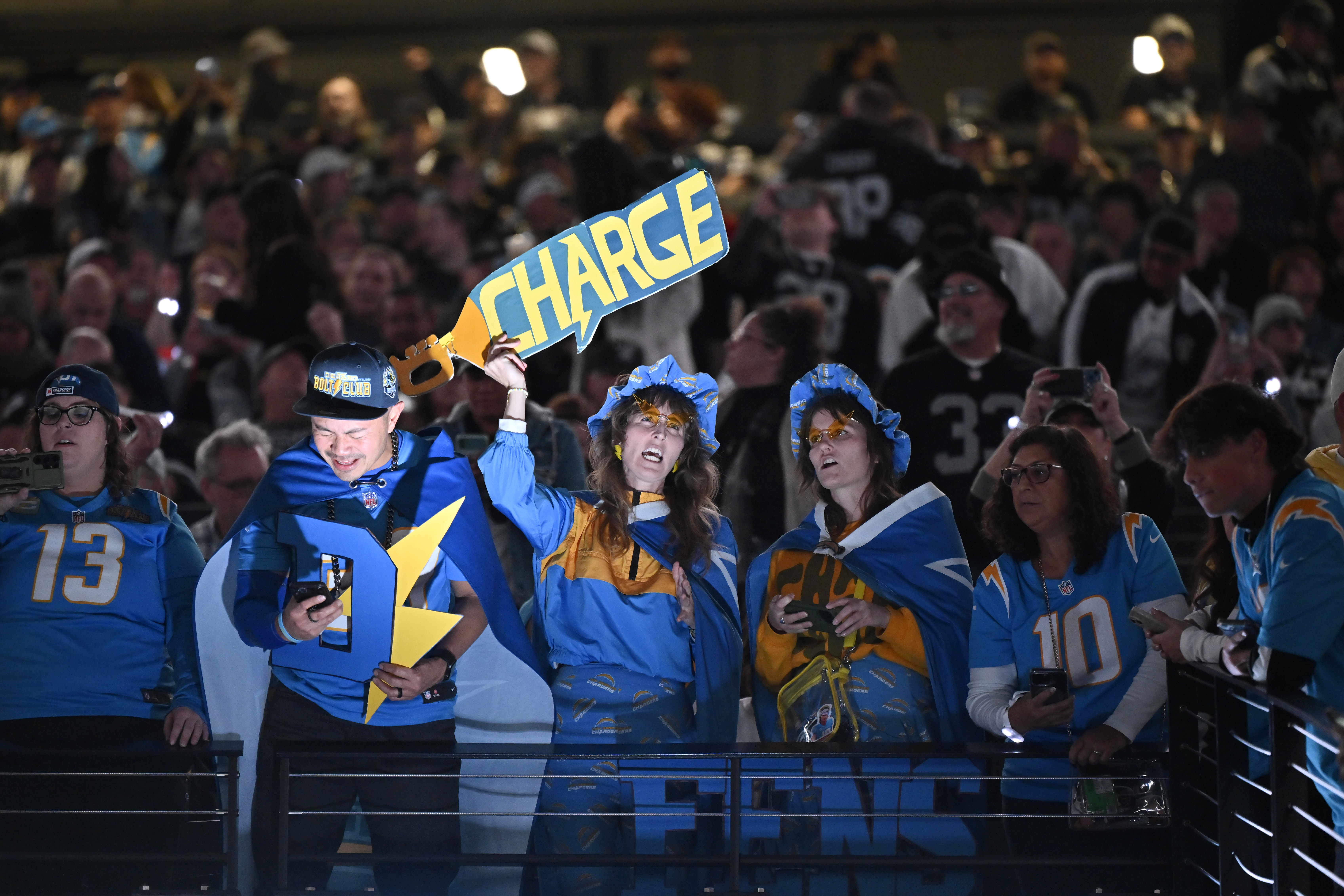 Los Angeles Chargers fans cheer before an NFL football game between the Las Vegas Raiders and the Los Angeles Chargers, Thursday, Dec. 14, 2023, in Las Vegas. (AP Photo/David Becker)