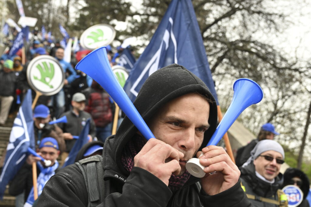 Protesters march during a demonstration of the KOVO trade union against the changes in the pension system considered by the government, in Prague, Czech Republic, Wednesday March 29, 2023. (Michal Kamaryt/CTK via AP)