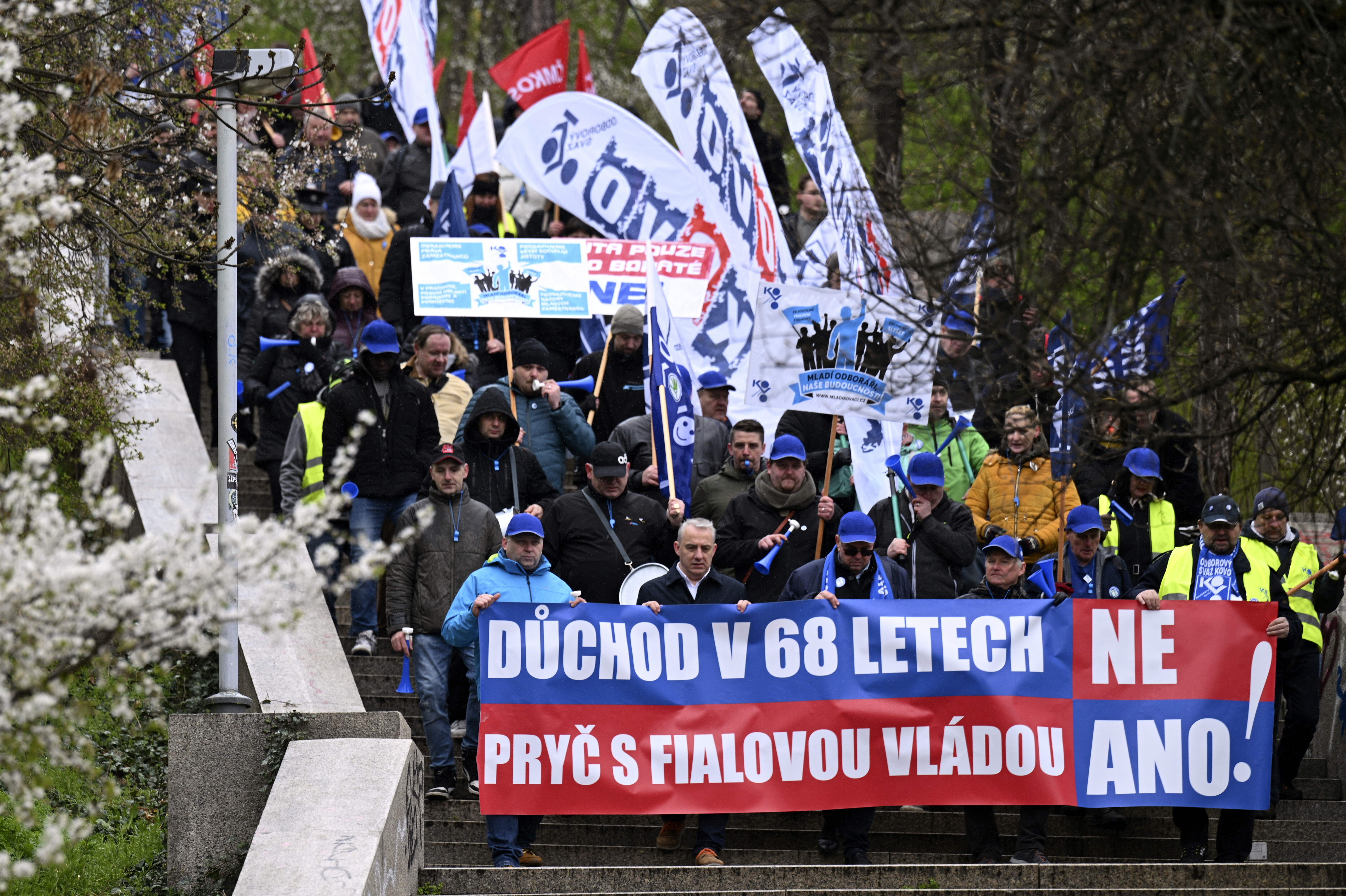 Protesters march during a demonstration of the KOVO trade union against the changes in the pension system considered by the government, in Prague, Czech Republic, Wednesday March 29, 2023. (Michal Kamaryt/CTK via AP)