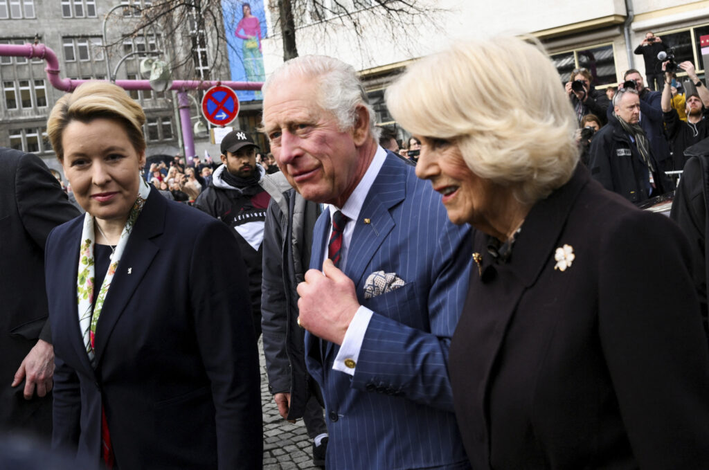 Berlin's Mayor Franziska Giffey, Britain's King Charles and Camilla the Queen Consort visit a farmer's market on Wittenbergplatz square, in Berlin, Germany, Thursday, March 30, 2023. (Annegret Hilse//Pool Photo via AP)