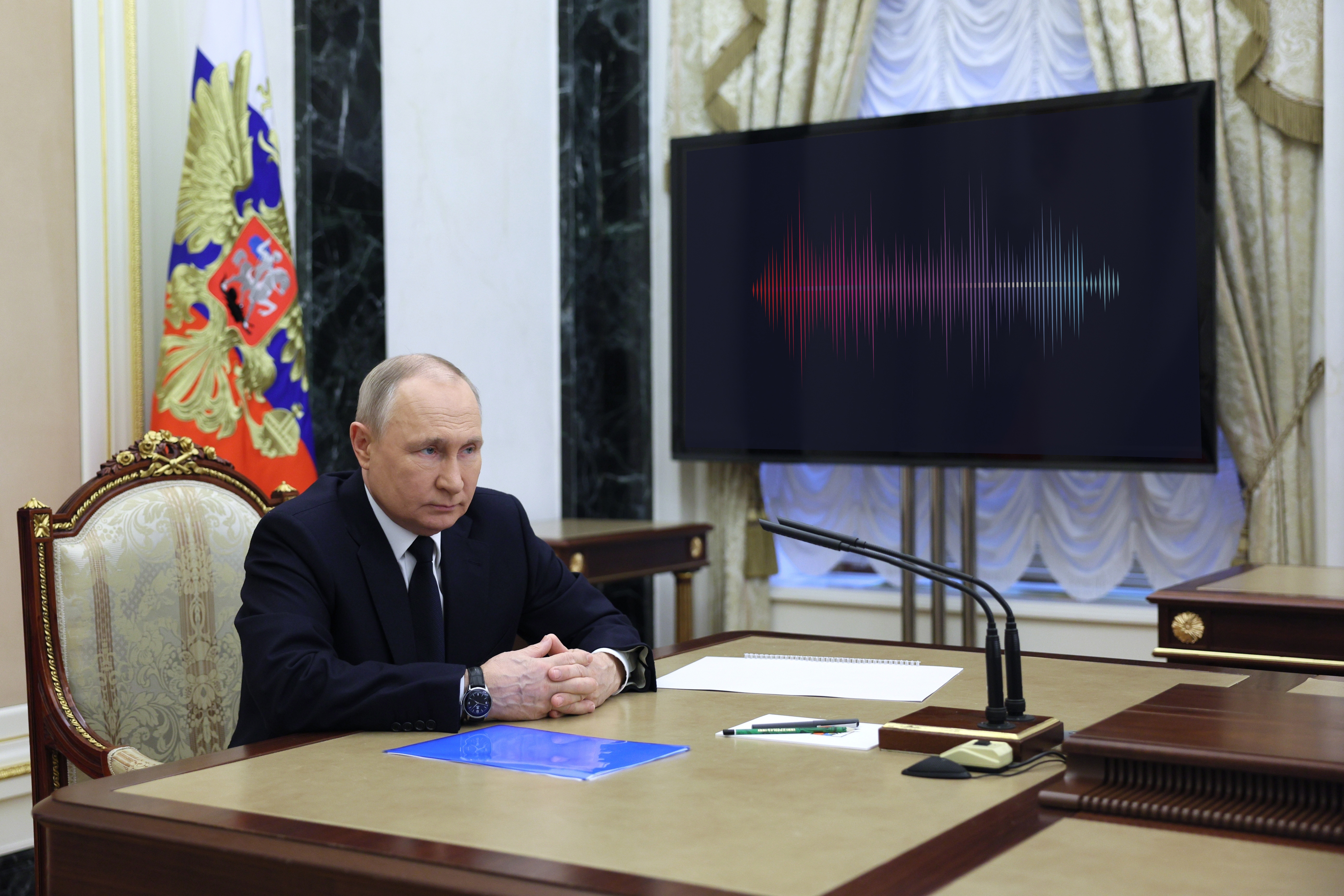 Russian President Vladimir Putin listens to Russian Transport Minister Vitaly Savelyev during their meeting in Moscow, Russia, Saturday, March 25, 2023. (Gavriil Grigorov, Sputnik, Kremlin Pool Photo via AP)