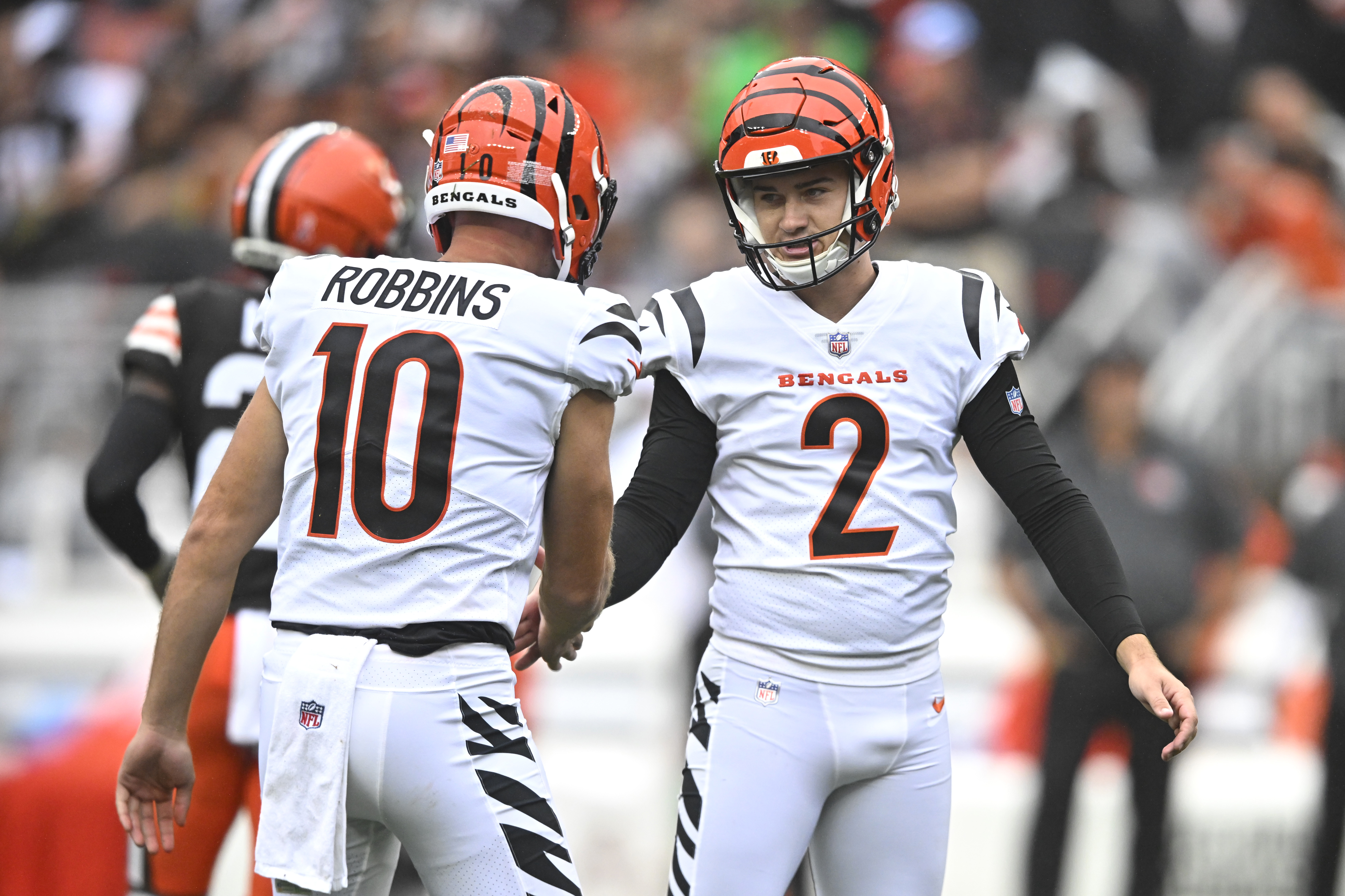 Cincinnati Bengals place kicker Evan McPherson (2) celebrates his field goal with teammate Brad Robbins (10) during the second half of an NFL football game Sunday, Sept. 10, 2023, in Cleveland. (AP Photo/David Richard)