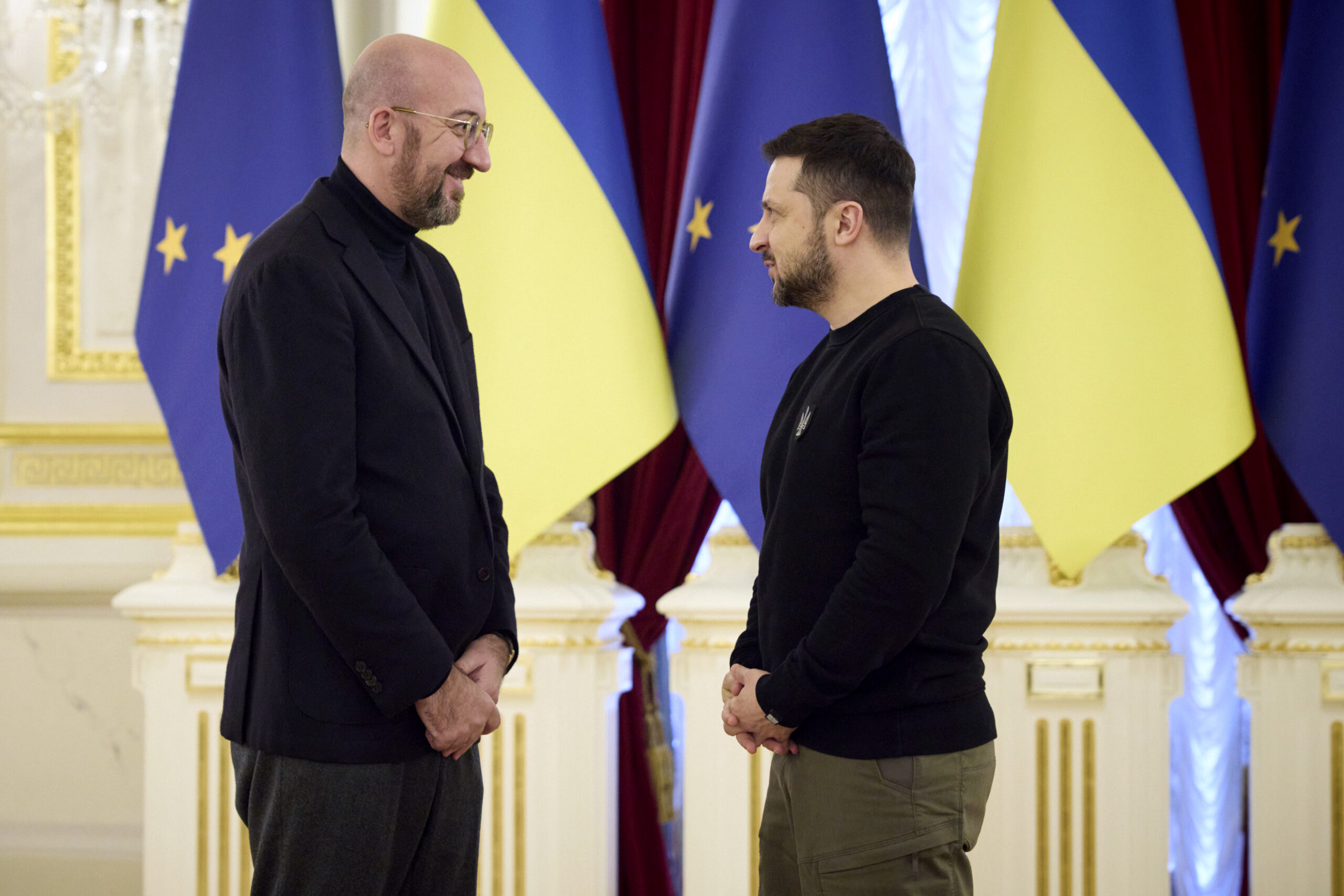 Ukrainian President Volodymyr Zelenskyy, right, greets European Council President Charles Michel during the EU-Ukraine summit in Kyiv, Ukraine, Friday, Feb. 3, 2023. (Ukrainian Presidential Press Office via AP)