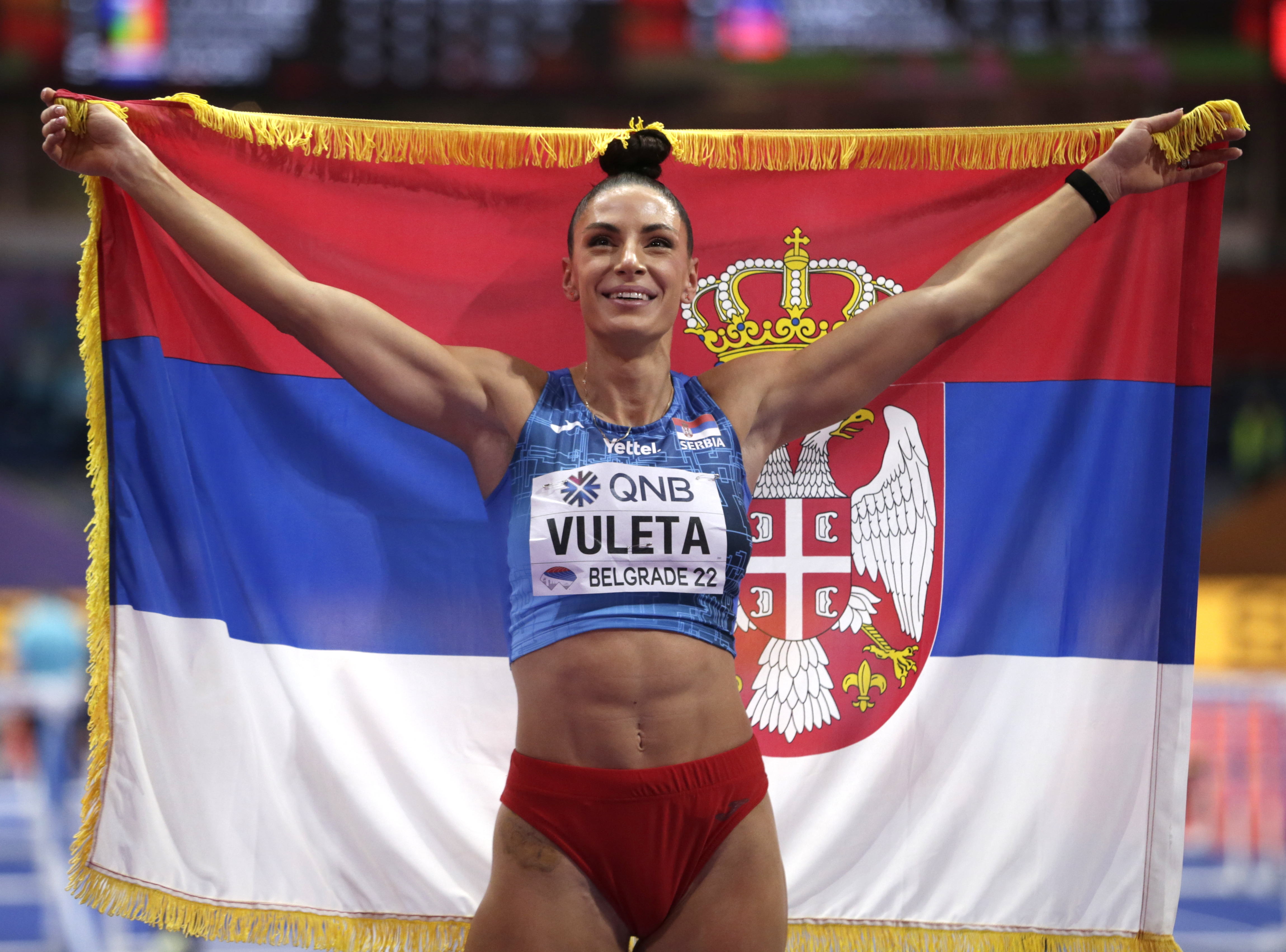 epa09839163 Ivana Vuleta of Serbia celebrates after winning the women's Long Jump final at the IAAF World Athletics Indoor Championships in Belgrade, Serbia, 20 March 2022.  EPA-EFE/ANDREJ CUKIC