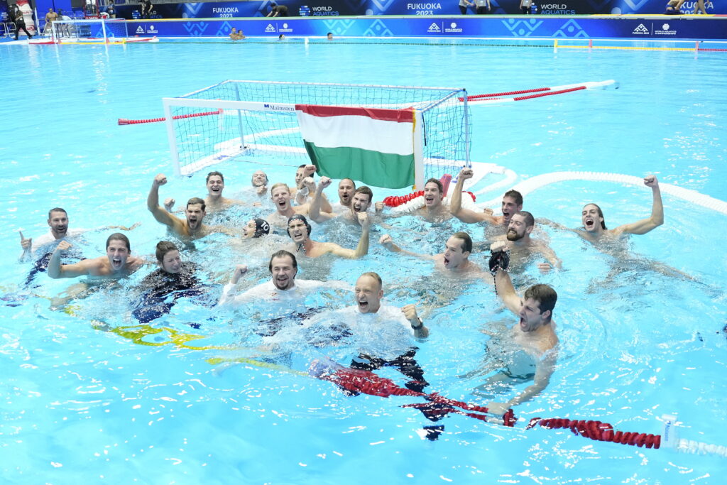 Team Hungary celebrate after winning their men's water polo gold medal match against Greece at the World Swimming Championships in Fukuoka, Japan, Saturday, July 29, 2023. (AP Photo/Eugene Hoshiko)
