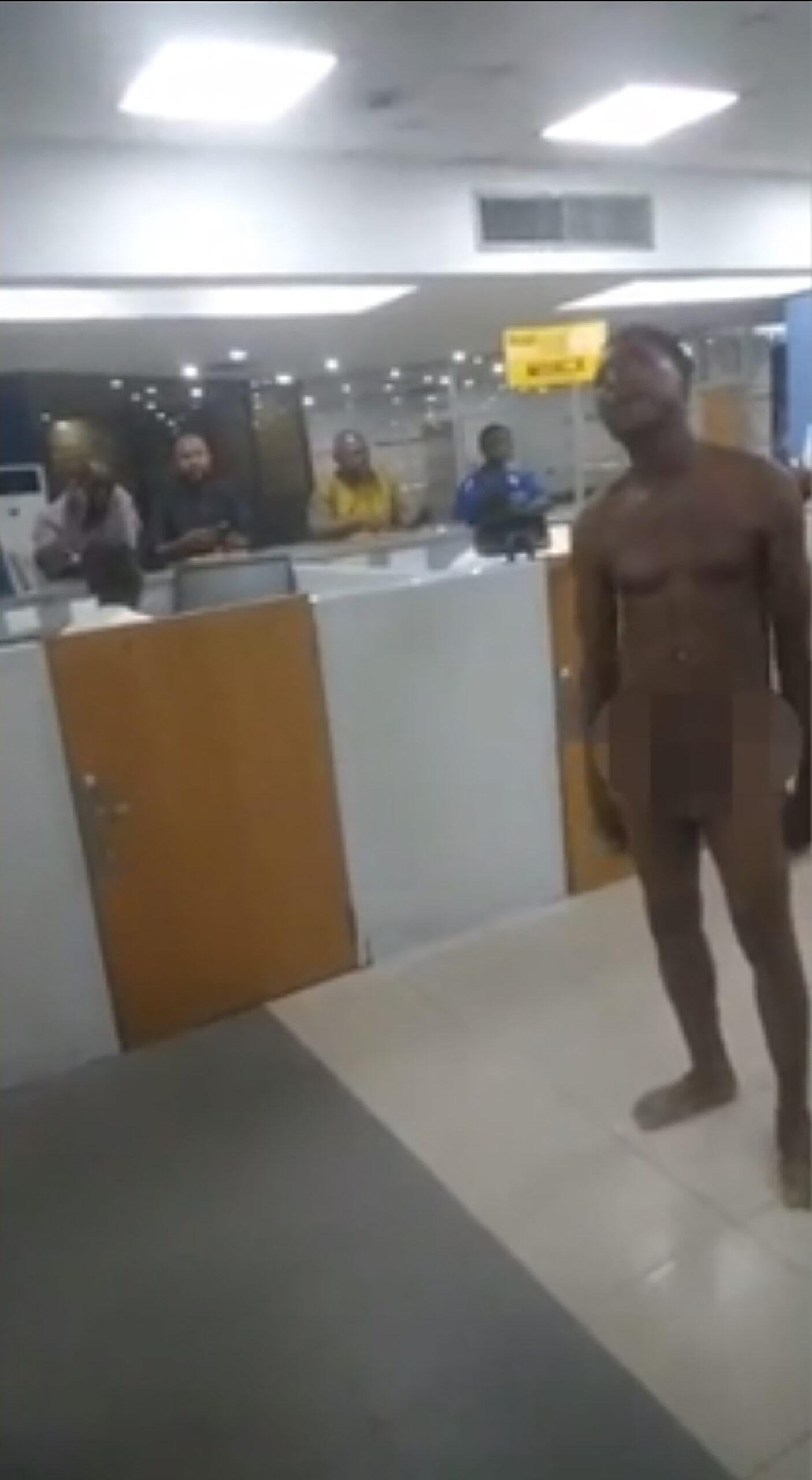 Desperate bank customers strip naked and fight in mass brawls to get to ATMs in chaotic scenes in Nigeria after Government replaced bank notes...but printed too few