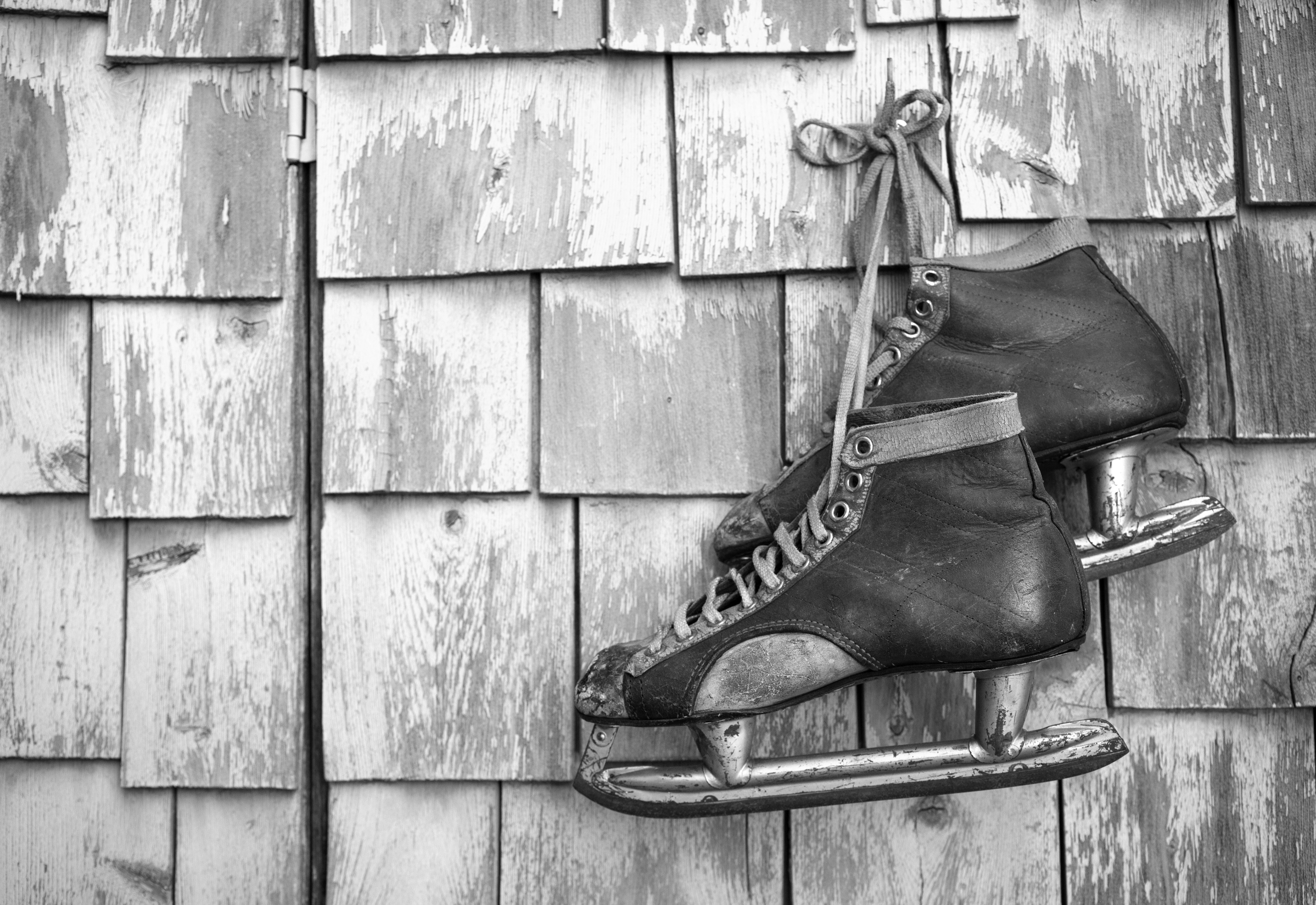 Vintage,Masculine,Leather,Ice,Skate,Hanging,On,A,Green,Mint