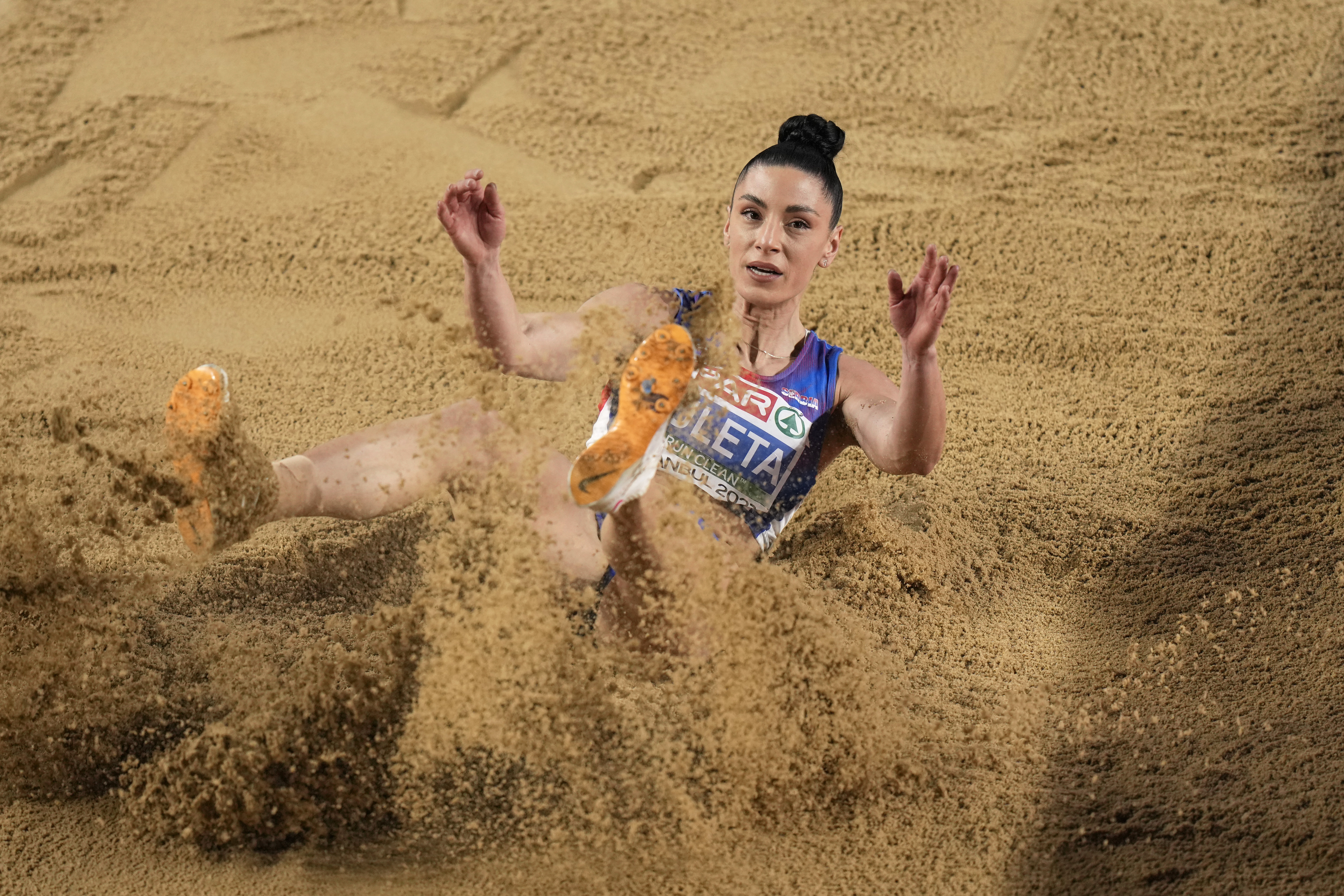Ivana Vuleta, of Serbia, makes an attempt in the Women Long Jump final at the European Athletics Indoor Championships at Atakoy Arena in Istanbul, Turkey, Sunday, March 5, 2023. (AP Photo/Khalil Hamra)
