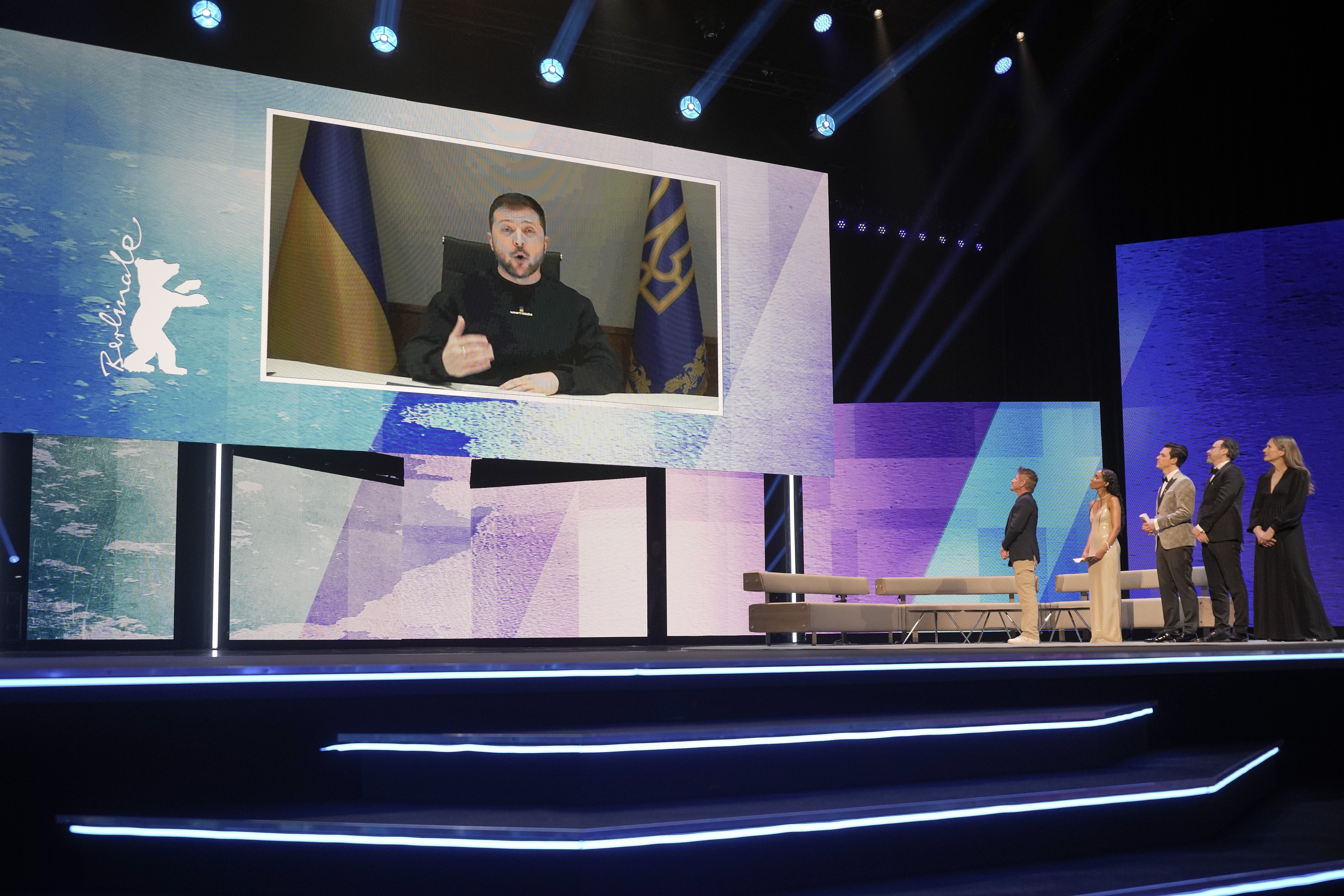 Ukrainian President Volodymyr Zelenskyy addresses the audience via video link during the opening ceremony at the International Film Festival Berlin 'Berlinale', in Berlin, Germany, Thursday, Feb. 16, 2023. (AP Photo/Markus Schreiber)
