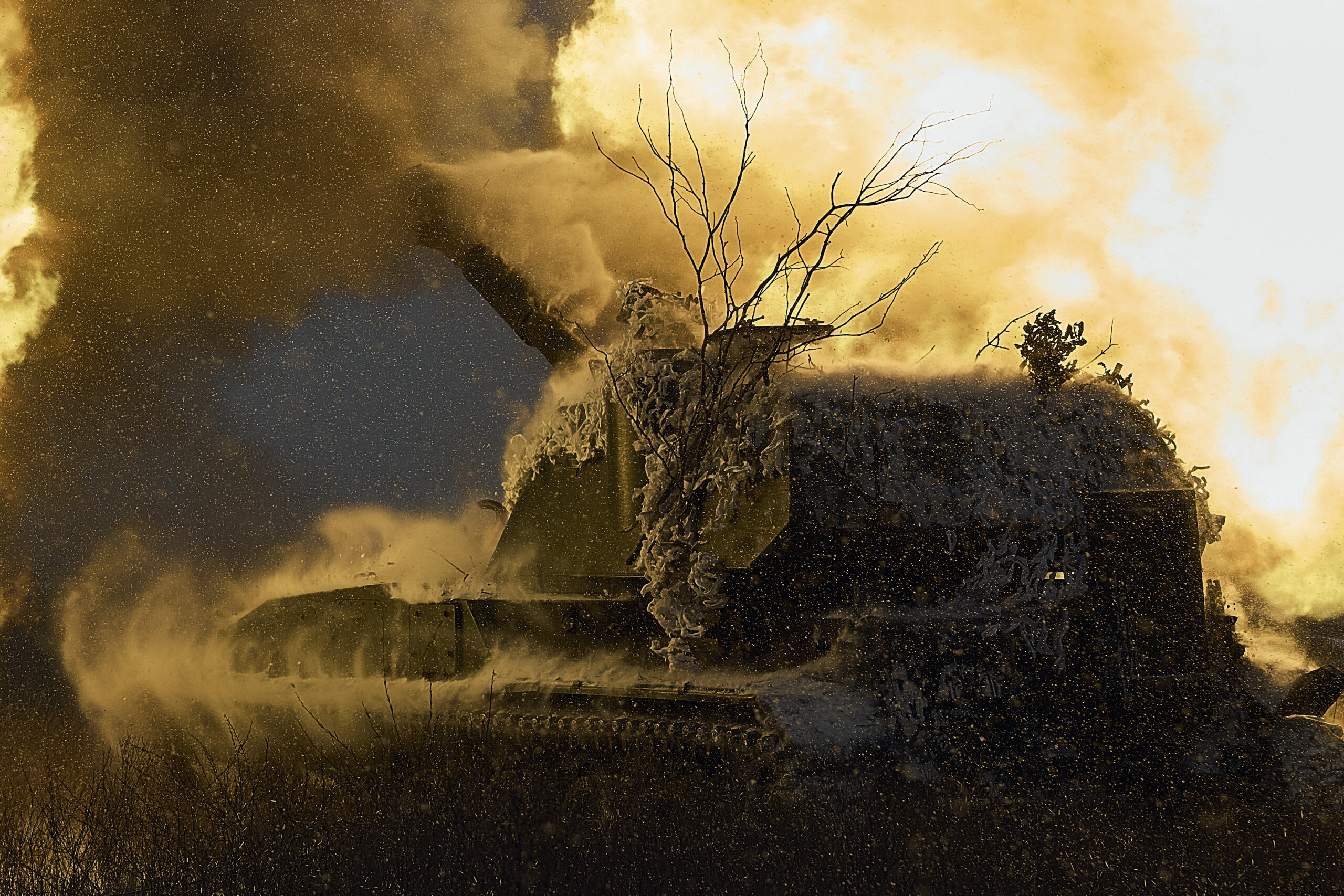 A self-propelled artillery vehicle fires on the frontline, Donetsk region, Ukraine, Saturday, Feb. 18, 2023. (AP Photo/Libkos)