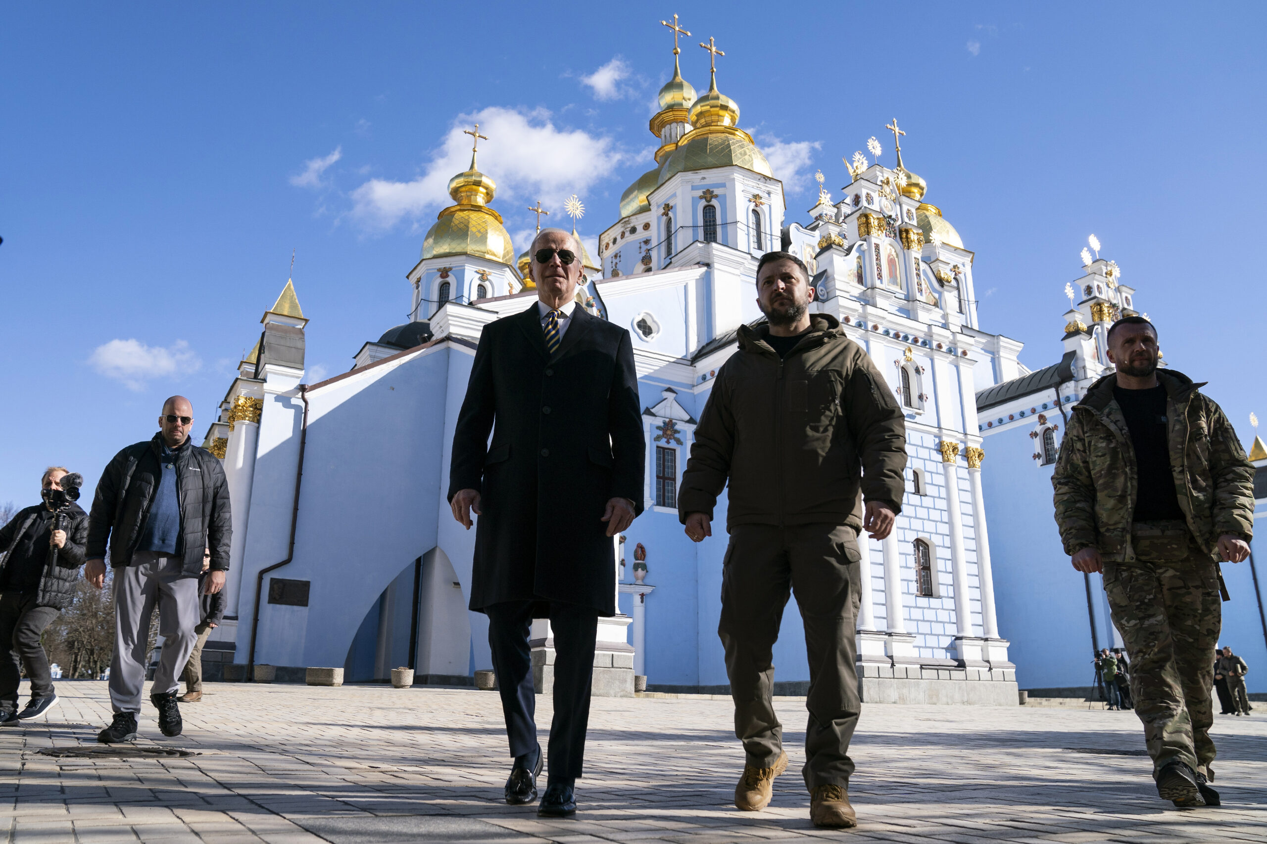 US President Joe Biden, centre left, walks with Ukrainian President Volodymyr Zelenskyy at St. Michael's Golden-Domed Cathedral during an unannounced visit, in Kyiv, Ukraine, Monday, Feb. 20, 2023. (AP Photo/Evan Vucci)