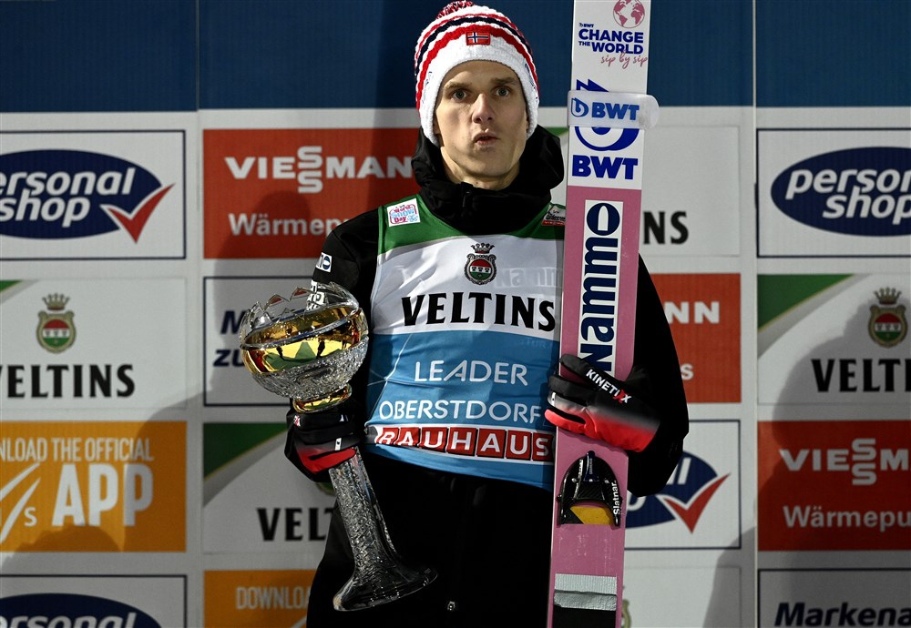 epa10381708 Halvor Egner Granerud of Norway holds his trophy on the podium after winning the first stage of the 71st Four Hills Ski Jumping Tournament in Oberstdorf, Germany, 29 December 2022.  EPA-EFE/Anna Szilagyi