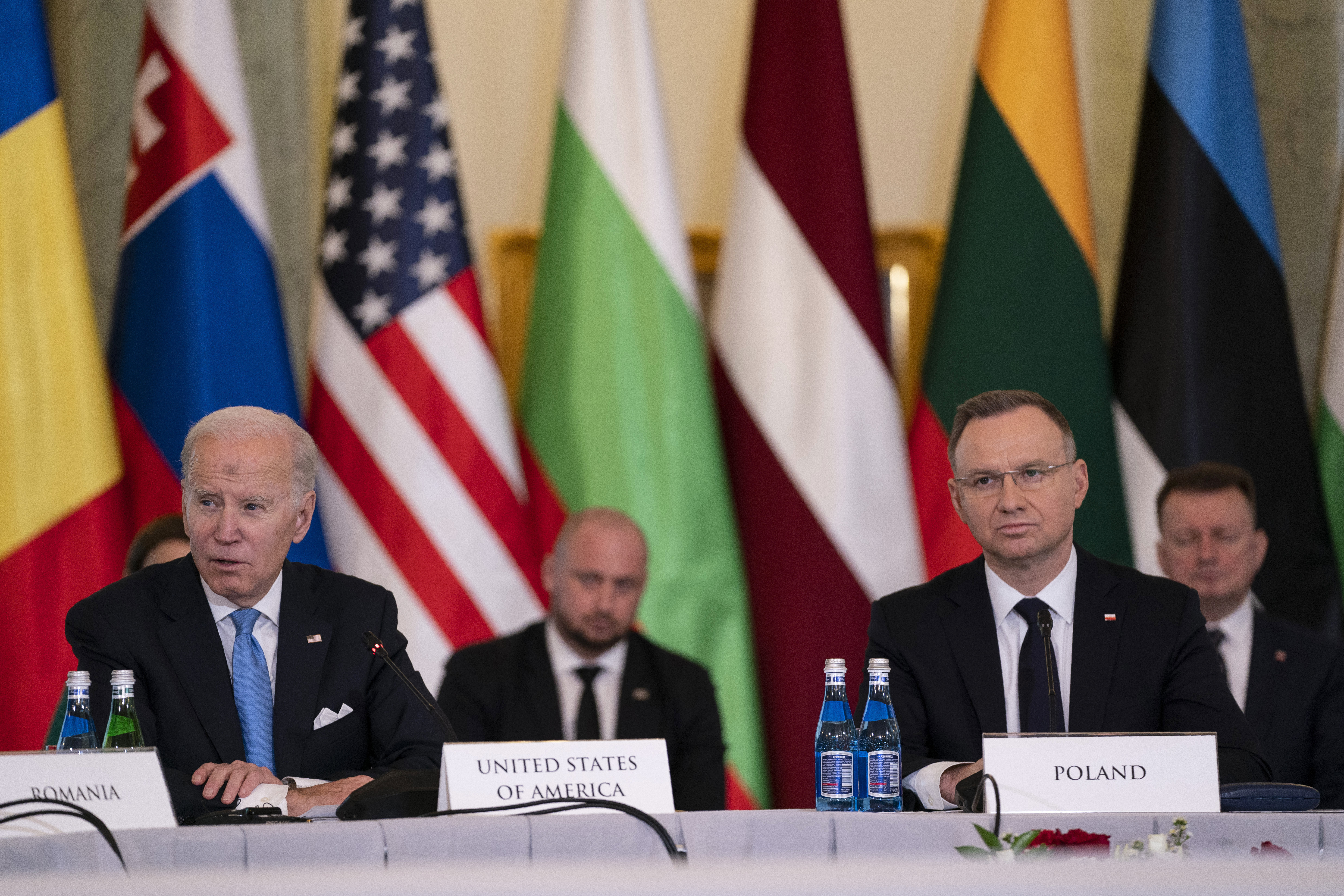 Polish President Andrzej Duda listens as President Joe Biden speaks during a meeting with the leaders of the Bucharest Nine, a group of nine countries that make up the eastern flank of NATO, Wednesday, Feb. 22, 2023, in Warsaw. (AP Photo/ Evan Vucci)