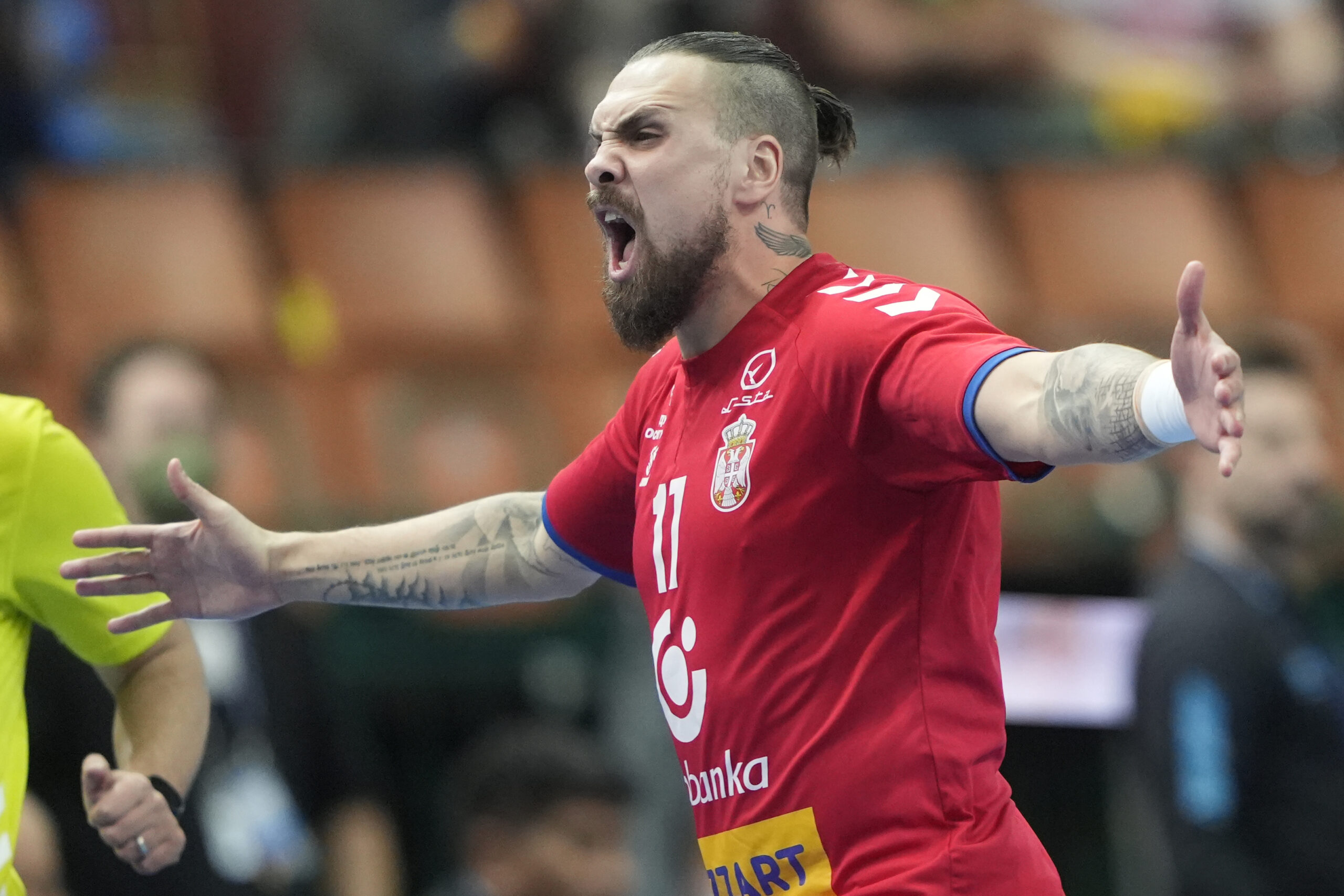 Serbia's Bogdan Radivojevic celebrates after scoring during the Main Round Group III, Handball World Championship match between Serbia and Argentina in Katowice, Poland, Saturday, Jan. 21, 2023. (AP Photo/Piotr Hawalej)