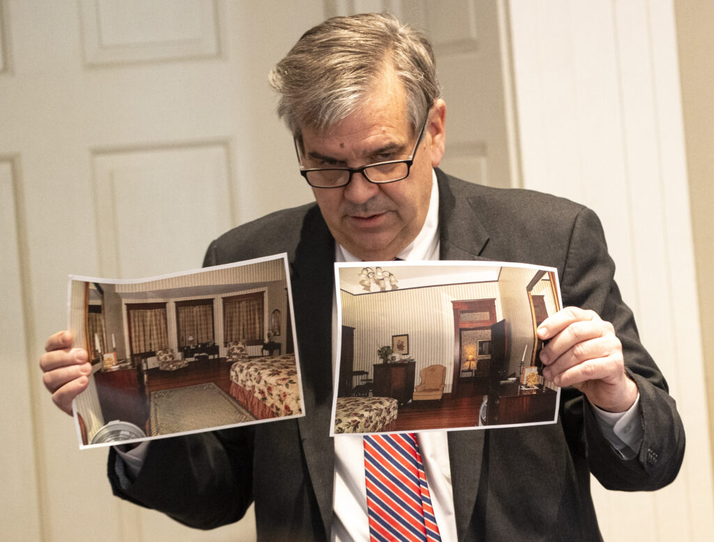 Prosecutor John Meadors holds up photographs for the jury in the double murder trial of Alex Murdaugh at the Colleton County Courthouse in Walterboro, S.C., on Monday, Feb. 6, 2023. (Andrew J. Whitaker/The Post And Courier via AP, Pool)