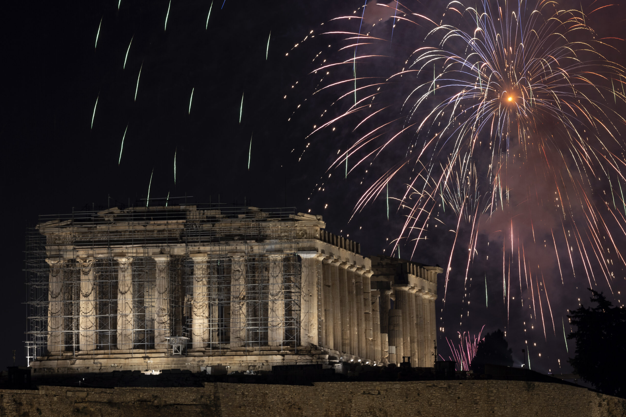 Fireworks explode over the ancient Parthenon temple at the Acropolis hill during New Year celebrations in Athens, Greece, Sunday, Jan. 1, 2023. (AP Photo/Yorgos Karahalis)