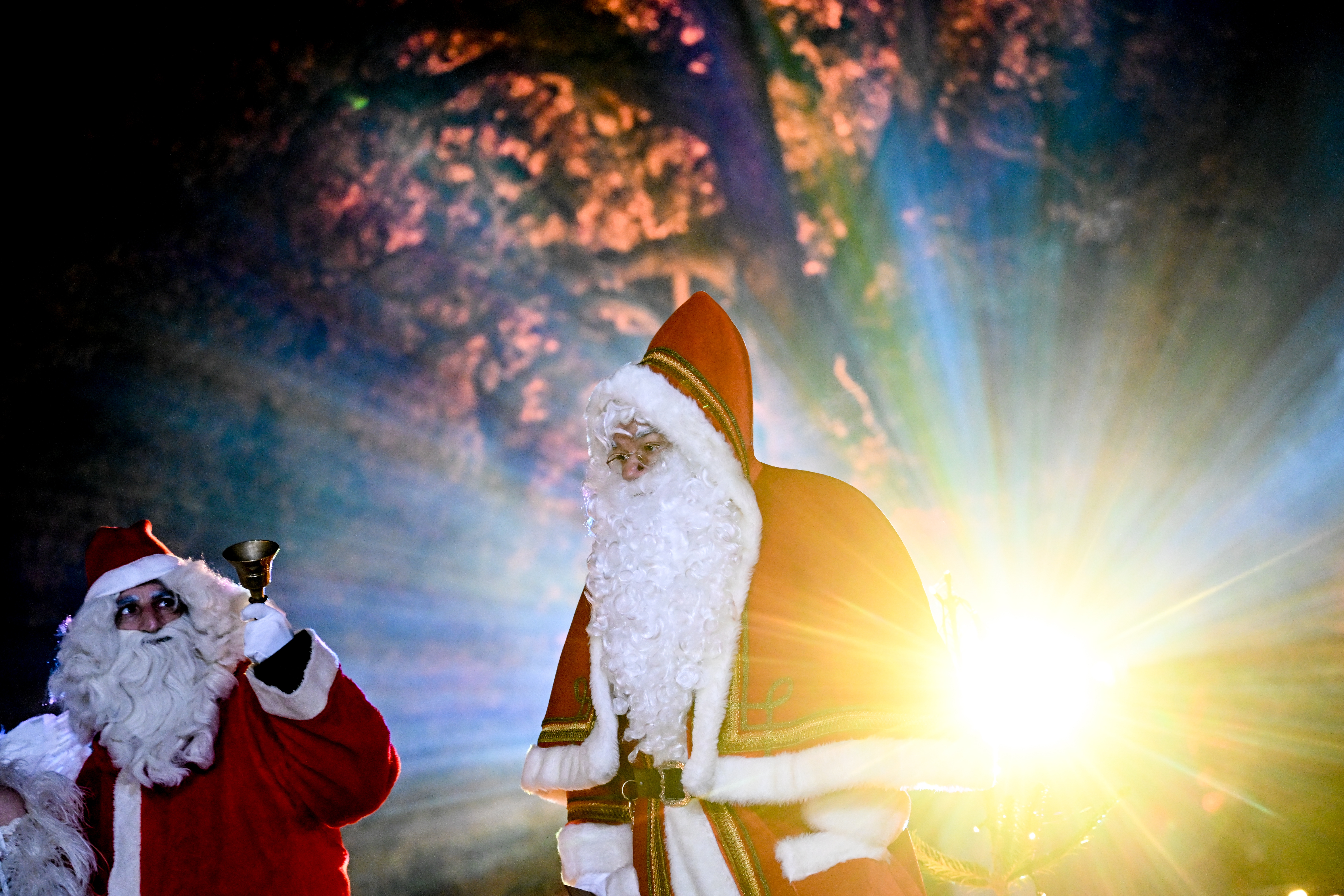 epa10333325 People dressed in costumes attend Santa Claus General Assembly at the Friedrichsfelde palace  at the Christmas illuminated Tierpark in Berlin, Germany, 27 November 2022.  EPA-EFE/FILIP SINGER
