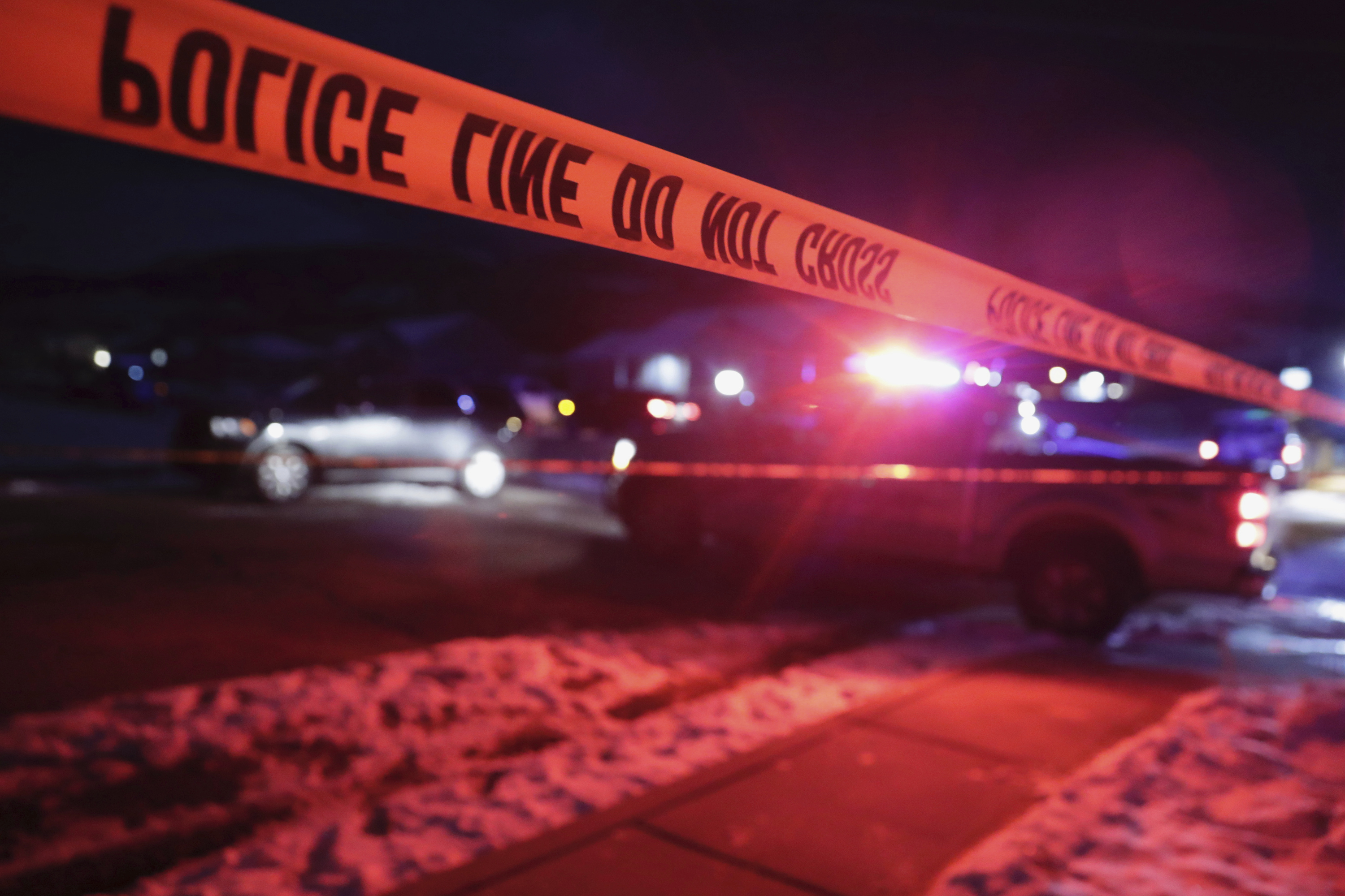 Police tape surrounds the crime scene in Enoch, Utah, where eight members of a family were found from gunshot wounds, Wednesday, Jan. 4, 2023. (Ben B. Braun/The Deseret News via AP)