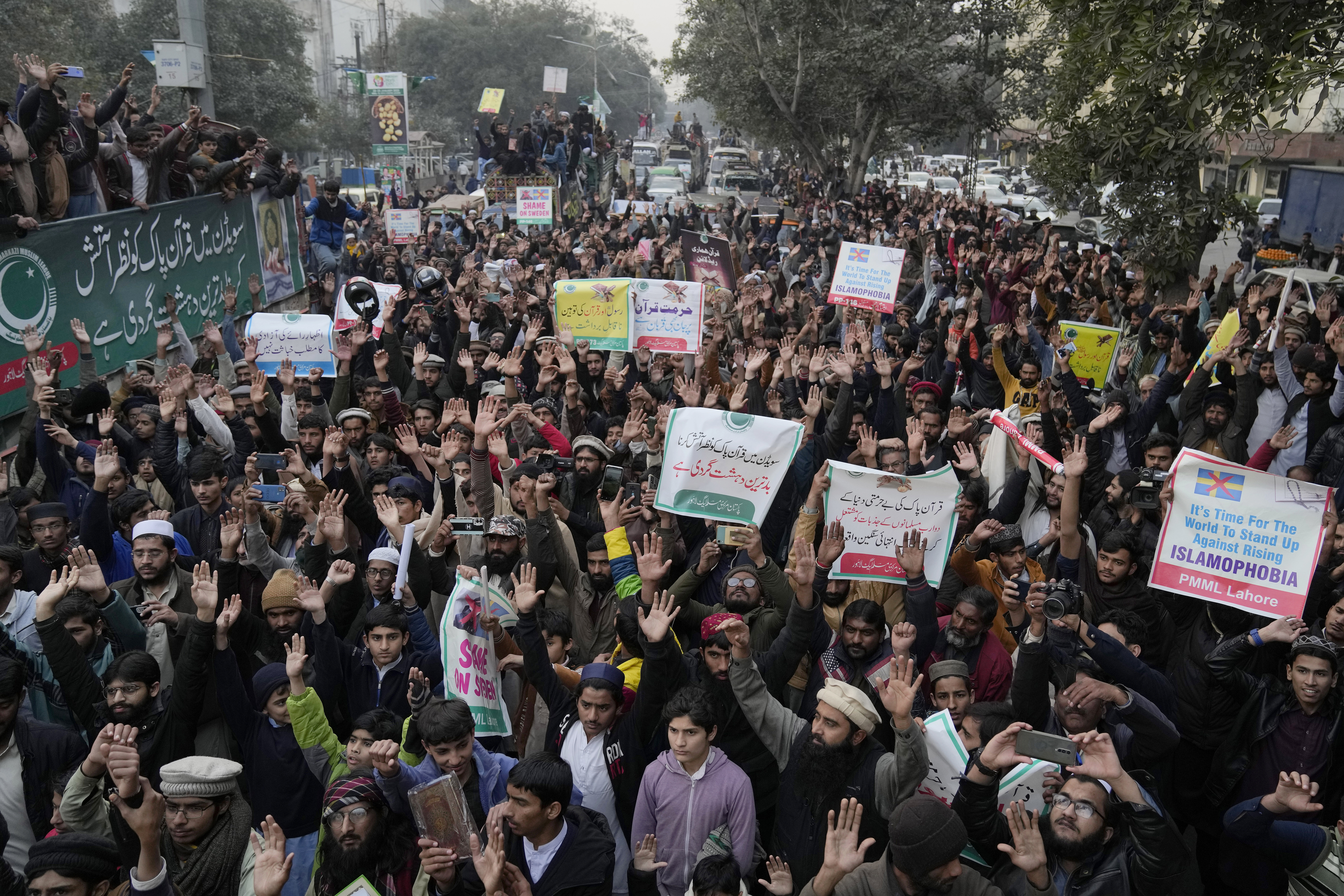 Supporters of Pakistan Markazi Muslim League party chant slogans during a rally against the burning of Quran, a Muslim holy book, by a Danish anti-islam activist, in Lahore, Pakistan, Tuesday, Jan. 24, 2023. (AP Photo/K.M. Chaudary)