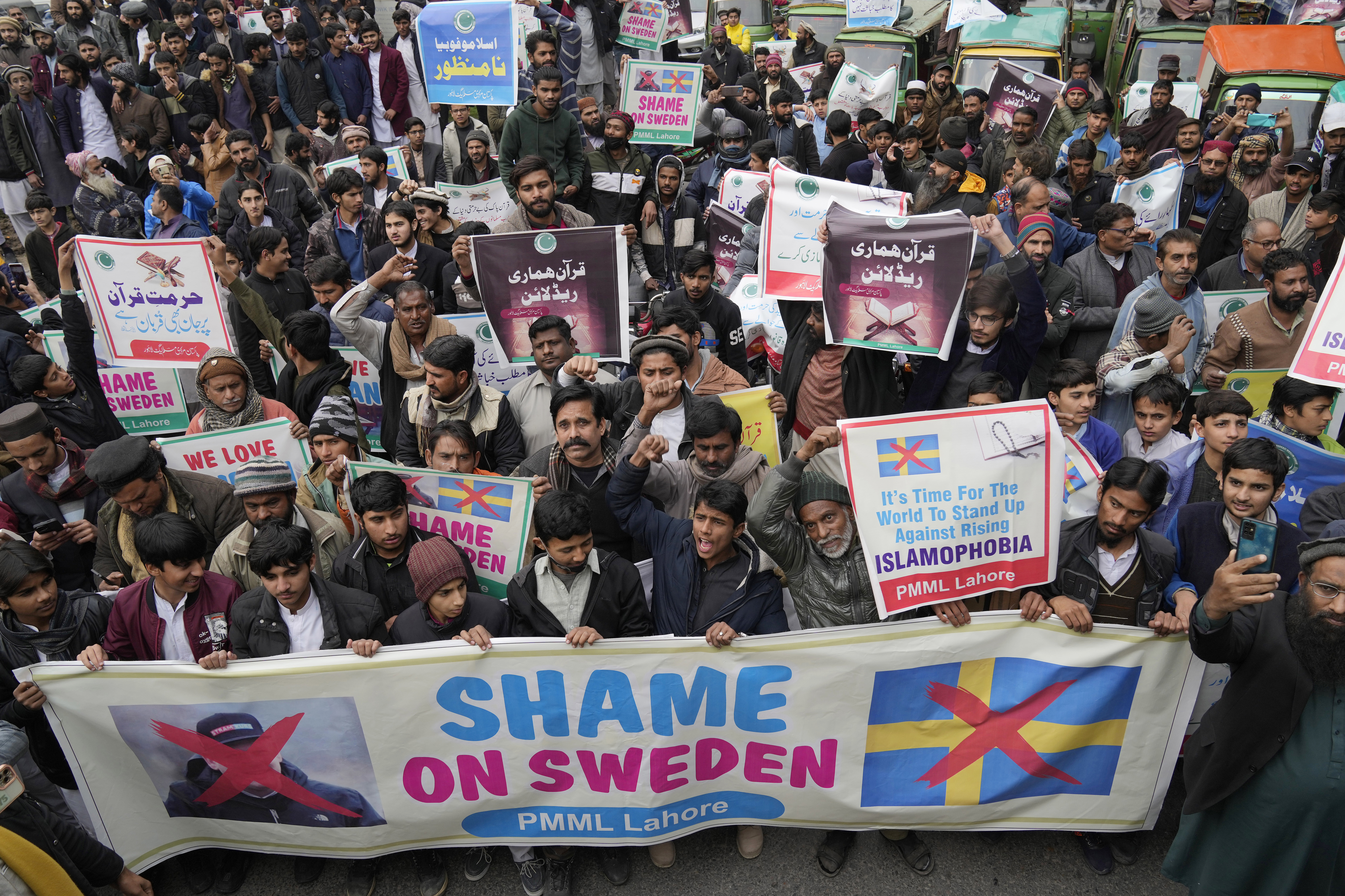 Supporters of Pakistan Markazi Muslim League party chant slogans during a rally against the burning of Quran, a Muslim holy book, by a Danish anti-islam activist, in Lahore, Pakistan, Tuesday, Jan. 24, 2023. (AP Photo/K.M. Chaudary)